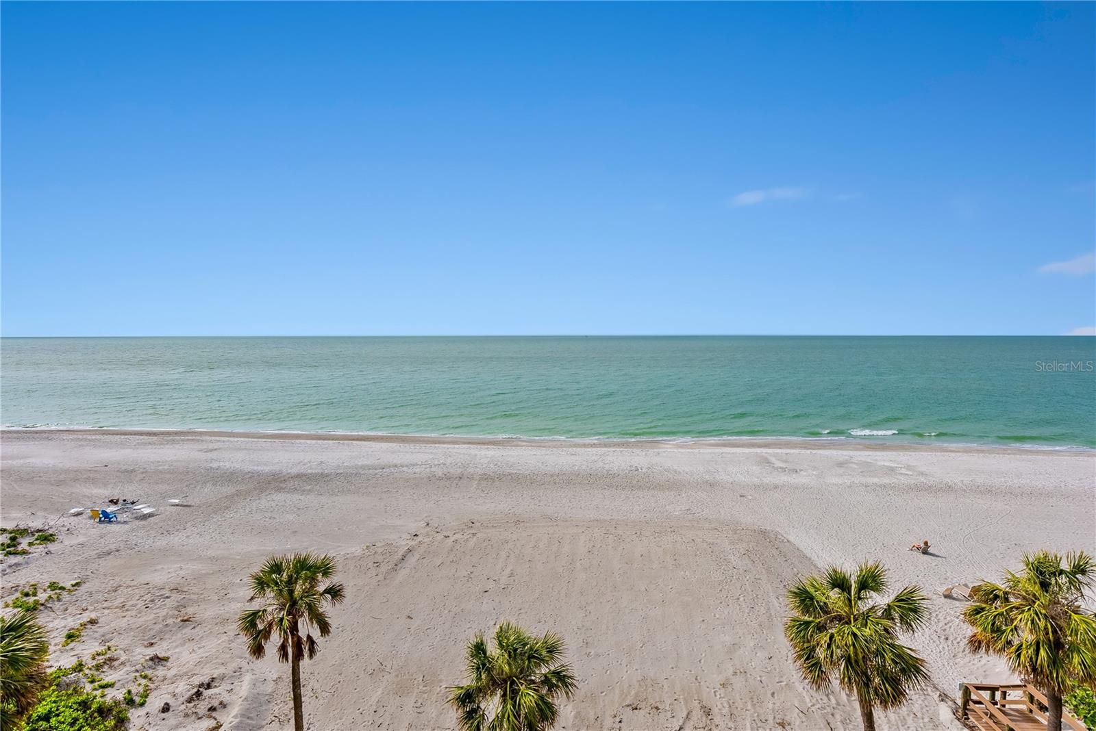 Some Photo's are virtually staged !   Spectacular gulf front views from this 5th floor 2 bedroom/ 2 bathroom condo residence in rarely available Longboat Beach House with convenient mid key location in close proximity to Longboat Key shops & restaurants as well as Bayfront Park with its pickleball courts and kayak launch and St Armands Circle. Left entirely unscathed by the recent storms, this unit includes impact windows & sliding doors, storm shutters, new flooring & fresh paint and is enhanced by its 6' x 38'  gulf front terrace overlooking the tranquil waters of the Gulf of Mexico and its vibrant marine life and dazzling sunsets. A heated pool compliments the resort lifestyle.