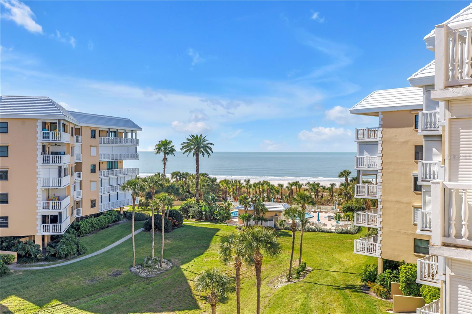 An exceptional opportunity awaits the most discerning buyer seeking an elegant, impeccably updated condo in the Gulf-front community of Silver Sands. Beautifully updated and offering stunning Gulf views from your private balcony—perfect for enjoying sunsets and tranquil coastal living. The condo provides a serene and refined setting ideal for full-time living or a luxurious second home. No detail has been overlooked. The showstopping chef’s kitchen features a Sub-Zero double refrigerator, Viking ovens, Wolf induction glass cooktop, imported Italian marble countertops, breakfast bar seating for four, full-size wine storage, and custom hand-finished Omega cabinetry throughout. There is even an opportunity to add a built-in coffee station. Tile flooring enhances the kitchen and all baths, while the great room, primary bedroom, and guest bedroom feature engineered wood flooring that feels wonderfully soft underfoot. New expansive impact windows and sliders fill the space with abundant natural light. The spacious primary suite easily accommodates large furniture and offers Gulf views from the bed, along with ample room for a desk, reading nook—or both. Three generous closets are fully outfitted with European closet organizers. The reimagined primary bath delivers a true spa experience with a double open walk-in shower, luxury rain shower heads, heated towel warmers, marble countertops, and a hand-painted sink. The guest bedroom is comfortably sized, and the full guest bath features a striking walk-in shower with beautiful granite that complements the countertop and custom cabinetry. A convenient powder room off the hallway includes a carved vanity with a marble counter. With its open layout, water views, and lush tropical landscaping, this residence feels far more like a private home than a typical condo. Additional features include brand-new impact windows and sliding doors, newer electrical panel and tankless water heater and hurricane shutters. Silver Sands is a 17-acre Gulf-front oasis set on the soft white sands of St. Pete Beach, offering two waterfront pools and spas, 24/7 gated and guarded security, six pickleball courts, tennis courts, a clubhouse with fitness center, large community room with full kitchen, table tennis, and billiards. The community is self-managed on site with a strong HOA. Ideally located just one block off Gulf Boulevard, you are minutes from restaurants, shopping, and the Corey Avenue Sunday Market, with easy access to downtown St. Petersburg and St. Pete/Clearwater and Tampa International Airports.