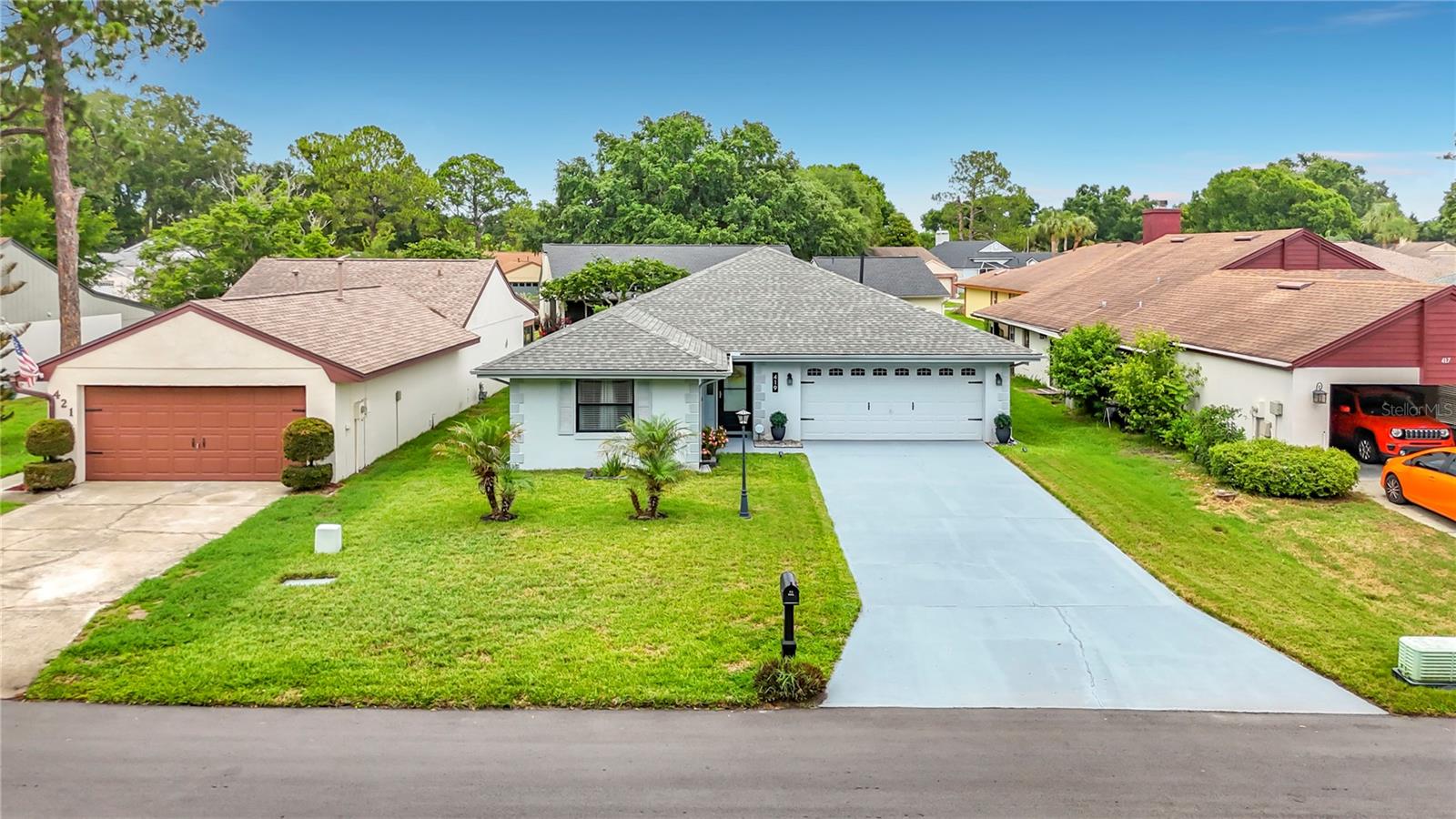 Cypresswood Golf & Country Club welcomes you to 419 Greenfield Drive.  This desirable gated golf community has a host of activities and treasures, but by far the most impressive one is this gem and it shows.  As you pull up to the extended driveway, low maintenance landscape ushers you into a well appointed home.  Once in the front door, sparkling floor tiles guide you through this beautiful 3 bedroom 2 bath split floor plan home.  Quartz counters and wall to wall cabinet space give anyone that loves to cook the space they need to store items and create meals while hosting family or company.  Right off of the kitchen there is a climate controlled Florida room, with an additional screened-in patio to the rear. When you are ready to retire for the evening, your primary bedroom has plenty of space to stretch out in and keep your belongings in the large walk-in closet. Move right in and leave your worries behind.  Not only has the kitchen and flooring been recently upgraded, all your major components have been replaced within the last 5 years - brand new electric panel w/surge protection installed (May 2026), roof (2022) , water heater (2021), A/C (2021).  Schedule your private tour and make this home yours for years to come.