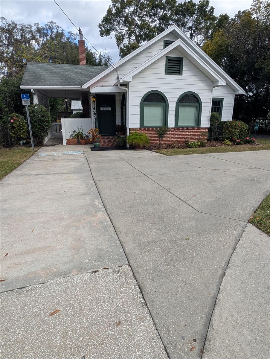 Excellent Location for a Professional Office or Residence! 1500 SF, 3 Private Offices, Large Reception Area with Fireplace, Conference Room. 2 Restrooms with 1 ADA Handicapped Equipped, Handicapped Parking and Entry Ramp. Fully Equipped Eat-in Kitchen with all appliances and ample cabinet space. Central Electric Air and Central Gas Heat. If used as a residential home, it is a 3 bedroom, 1.5 bath. 8 Total Parking Spaces, with 3 Covered. Built in 1937 with heart pine and oak wood floors. 9 ft. ceilings. Beautifully landscaped with many camellias and other plants. Owner is Listing Agent.