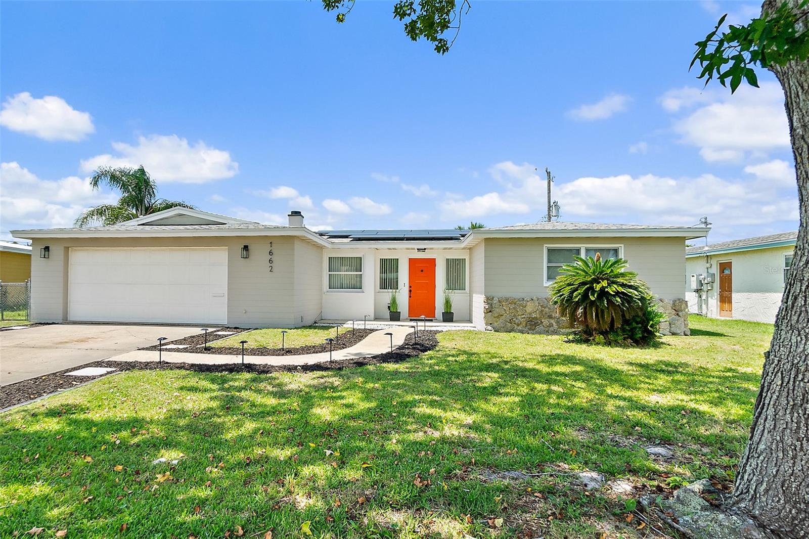 Act fast and this 3 bedroom, 2 bathroom, family home in the heart of South Daytona could be YOURS. Inside, family living and entertaining is a breeze thanks to the wonderful floor plan featuring living and dining spaces and a large outdoor patio that extends the living space outside. The bright and airy kitchen offers plenty of cabinets and counter space, and Island with seating. When night falls, there’s room for the whole family here with 2 spacious guest bedrooms, a guest bath, and a master suite offering an ensuite bath with walk-in shower. The home also offers a covered patio for added living space, and a fabulous fenced yard offering the perfect place for a garden, or a game of catch with the kiddos or fetch with Fido. Buyers here will have amazing peace of mind with a NEWER ROOF (2022), NEWER A/C (2022), and whole-home solar system. Other fantastic features here include: easy care terrazzo floors, fenced backyard, a 2-car garage, and a neighborhood with NO HOA and NO EXTRA FEES. A beautiful home where mountains of amazing new memories await you. Buyers here enjoy a fantastic central location near local colleges, shopping, beautiful parks, and a short drive to the beach! Don't delay, schedule your showing today!