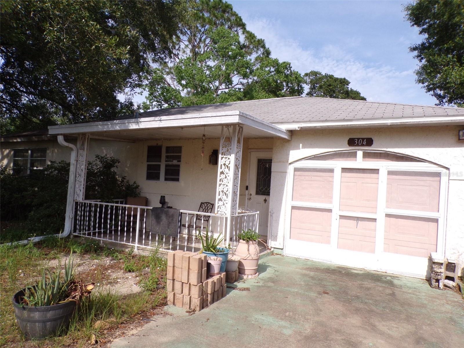 Home in Lake Joy community, priced for market and condition.  Short Sale and the property is a true "as is " property. This home would be great for First Time home buyer, investor or down sizer.   Living and dining area combo, off the kitchen.  Large primary with walk in closet and second bedroom is good size. Back porch opens to large back yard.   Close to shopping, schools and medical. Easy commute to the Villages and Ocala.  Buyer is responsible for turning power and water on for inspections. Bring all offers!