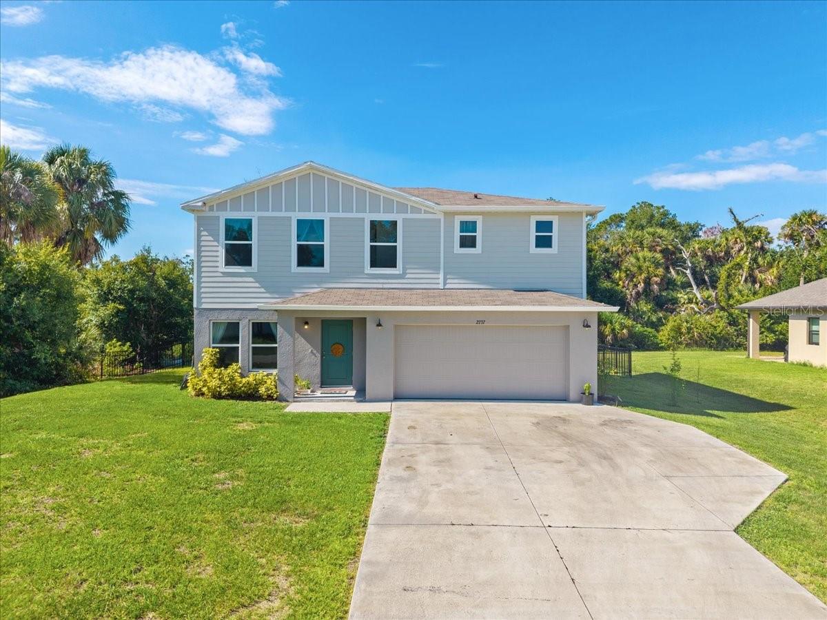 Looking for SPACE...FLEXIBILITY...and a PEACEFUL setting with a thriving GARDEN—this North Port gem has it all! Welcome to this inviting 4-bedroom, 3-bathroom home, designed with both comfort and functionality in mind. The open-concept floor plan seamlessly connects the living, dining, and kitchen areas, creating an inviting space for everyday living and effortless entertaining. A first-floor bedroom and full bathroom provide the perfect setup for guests, MULTI-GENERATIONAL living, a private home office or gym. Upstairs, you’ll find a versatile LOFT ideal for a second living area, playroom, media room, or workspace, along with a spacious laundry room for added convenience. The generous primary suite features a walk-in closet and private en-suite bathroom with dual sinks, while two additional bedrooms and another full bath complete the second level. Recent improvements include BRAND NEW hurricane impact sliding glass doors, FRESHLY painted exterior, and an EPOXY-coated garage floor. Step outside to the FULLY FENCED backyard where you’ll discover a flourishing garden already producing fruits and vegetables—perfect for gardening enthusiasts or anyone looking to enjoy fresh homegrown produce. With plenty of room for pets, play, or future outdoor enhancements, this backyard is ready for your personal touch. Enjoy the freedom of NO HOA and the convenience of being just minutes from the brand-new Imagine Charter School, Atwater Community Park & splash pad, shopping, dining, medical facilities, and everyday conveniences. Easy access to major roadways makes commuting a breeze while still allowing you to enjoy the peaceful lifestyle North Port is known for. Don’t miss this opportunity to own a spacious, move-in ready home with room to grow in a prime North Port location!