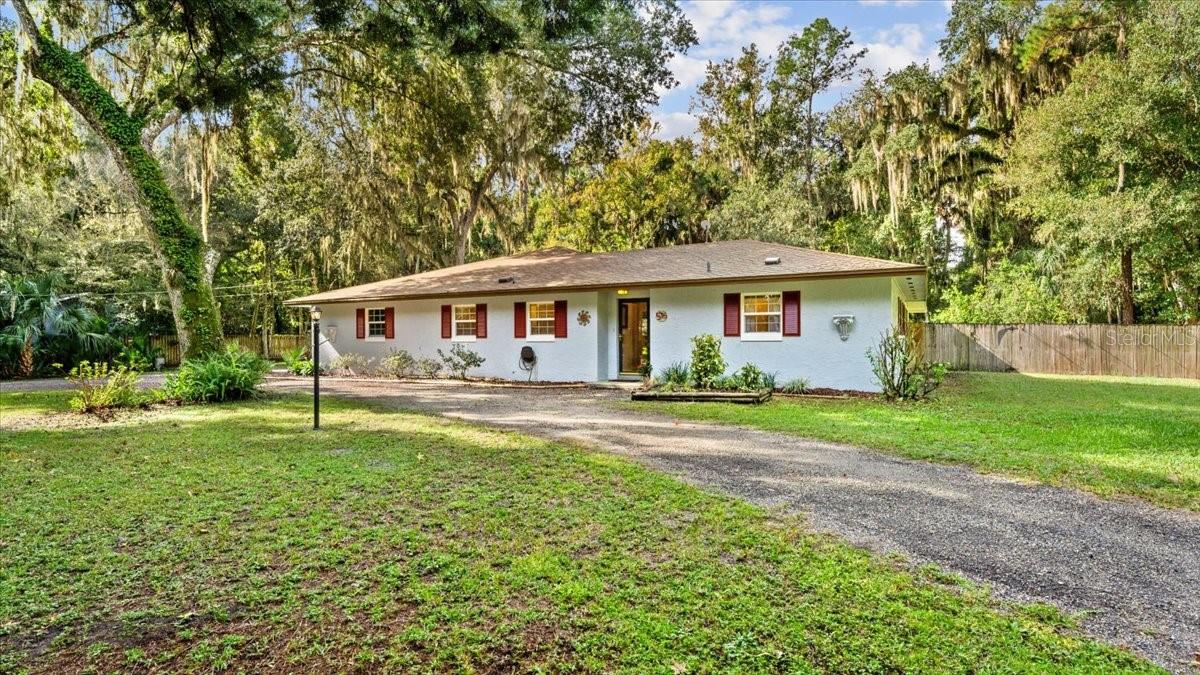 You will fall in love as you drive along the oak tree lined road leading to this incredible property. This location truly has it all, country living on a .83 acre, under 5 miles from beautiful NSB beaches, and only 5 minutes from shopping, restaurants and other city amenities.  Plus the local dog park and community tennis center is only a 10 min walk with no HOA fees. In the center of this majestic oak tree filled canopy sits a well constructed block home with 2 Master Suites, an open floor plan, a large screened lanai,  fireplace, breakfast bar and a brand new 2021 remodeled kitchen. The large free form inground pool is surrounded by a fully fenced backyard making this location a true oasis in the middle of the much sought after 32168 zip code. Included is an  oversized workshop with power and water, an oversized attached 2 car garage, a circular driveway and plenty of additional parking for all your toys. Don't wait, this property is a one of kind with unlimited potential. All info contained herein deemed accurate, but to be verified by the purchaser. ;Water: City