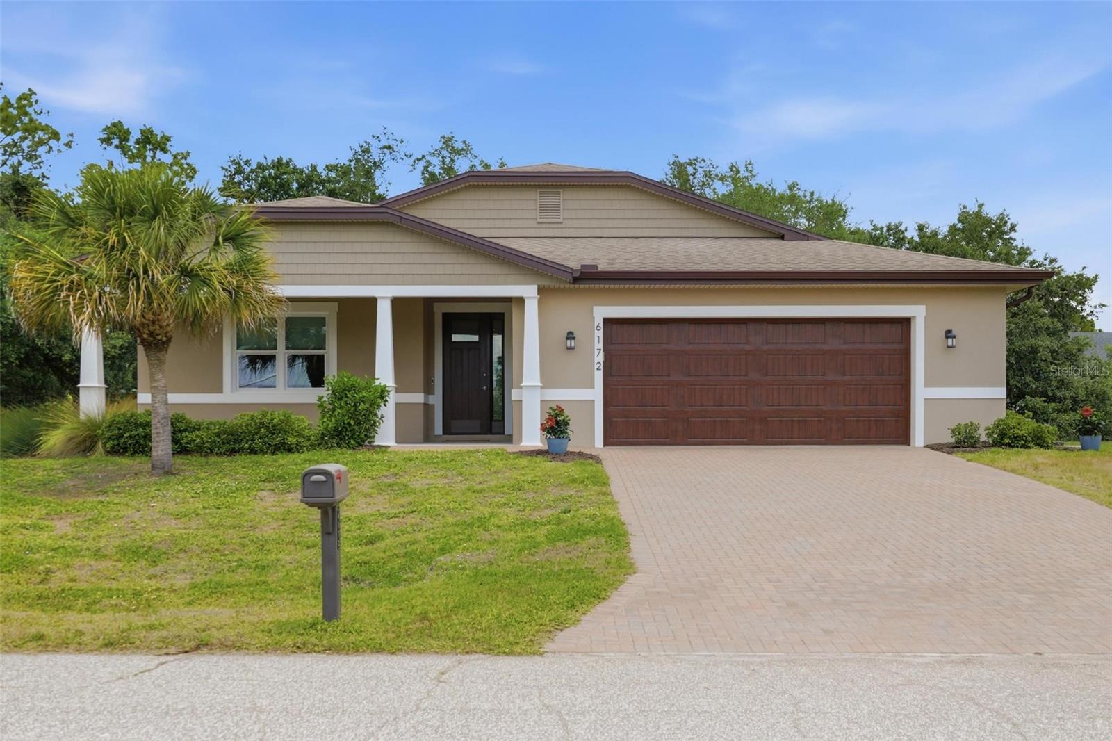 This exceptional 2020-built modern Florida residence offers a rare combination of cutting-edge construction, energy efficiency, and peace of mind in a quiet, no-HOA setting. Designed with durability and performance in mind, the home is constructed with NUDURA Insulated Concrete Forms (ICF), featuring 6” steel-reinforced poured concrete walls engineered to withstand winds up to 250 MPH, deliver up to four hours of fire resistance, and provide superior sound insulation and structural integrity. Inside, 2,445 square feet of thoughtfully designed living space showcases a bright, modern layout enhanced by impact-rated windows and doors, energy-efficient systems, and quality finishes throughout. The home features solid maple cabinetry, stainless steel Frigidaire Gallery Series appliances, and a tankless on-demand hot water system for modern convenience and efficiency. The open concept kitchen flows seamlessly into the main living areas, supported by a high-performance Bryant Coastal 2-stage 3-ton AC system, whole-house dehumidifier, and Bryant Evolution Connex WiFi touchscreen thermostat for precise climate control. Custom-designed steel ductwork with closed-cell foam insulation further enhances indoor comfort and efficiency. Built for long-term performance, the home includes a waterproof ZIP panel roof system with peel-and-stick membrane, architectural shingles, treated trusses for mold and insect resistance, and R-38 attic insulation. Exterior finishes include synthetic stucco with permanent color and PVC trim, eliminating the need for exterior painting and reducing maintenance for years to come. Set on a half-acre lot with room to expand, add an outbuilding, or build a pool, the property offers flexibility and privacy with an empty lot behind creating a tranquil rear view. Outdoor living is enhanced with a welcoming front porch, paver driveway, and rear patio ideal for relaxing or entertaining. The oversized 2-car garage easily accommodates larger vehicles, including full-size extended cab trucks. This is a rare opportunity to own a newer construction home designed for safety, efficiency, and long-term savings—offering utility and insurance costs significantly lower than the average home while delivering modern Florida living at its finest!