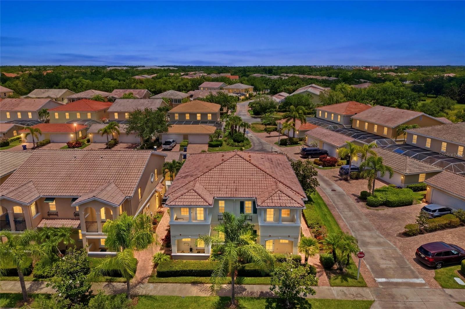One or more photo(s) has been virtually staged. Live the Florida lifestyle you've been dreaming of in this beautifully maintained Cayman model located in the award-winning, resort-style community of VillageWalk. This desirable corner townhome offers 3 bedrooms, 3 full baths, a 2-car garage, private courtyard, balcony, and over 1,800 square feet of thoughtfully designed living space. Enjoy engineered hardwood flooring, soaring ceilings, abundant natural light, and an open floor plan perfect for entertaining. VillageWalk is situated on more than 500 acres of lush tropical landscaping with miles of walking and biking trails, scenic lakes, and abundant wildlife. Residents enjoy a waterfront Town Center featuring a state-of-the-art fitness center, lap and lagoon pools, Har-Tru tennis courts, pickleball, basketball, bocce, café with full bar, tiki bar, hair salon, gift shop, and a full calendar of social activities. Ideally located near Siesta Key Beach, the Legacy Trail, top-rated schools, dining, shopping, and all that Sarasota has to give.