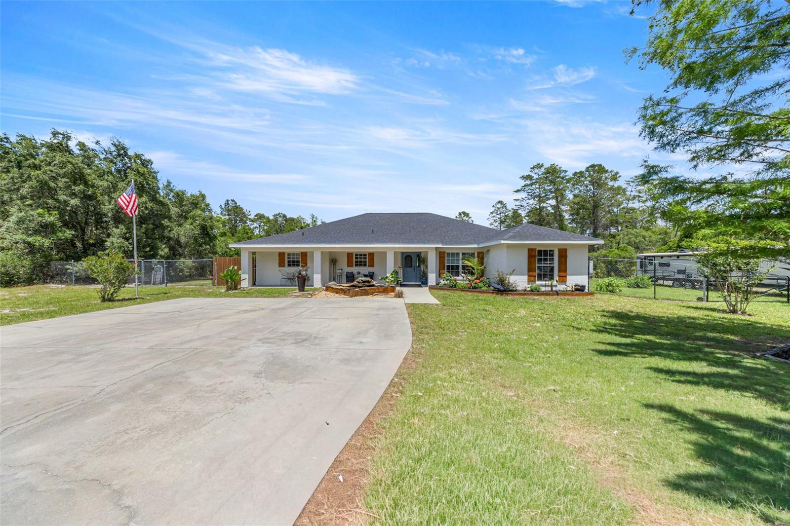 Nestled on just under 17 breathtaking acres in Ocklawaha, Florida, this rare private retreat at 495 Fisher Road offers the perfect blend of comfort, nature, and wide-open Florida living. Built in 2004 and thoughtfully enhanced with over $75,000 in improvements, this 3-bedroom plus office, 2-bath home spans just under 2,200 square feet and presents a truly unique opportunity to own acreage that backs directly to the Ocklawaha River. From the moment you arrive, the property welcomes you with a sense of privacy and tranquility. A 6-foot privacy fence along the front of the home, oversized driveway, mature trees, and a peaceful pond positioned at the front of the property create an inviting first impression. Inside, soaring cathedral ceilings, fresh interior and exterior paint, new wood-look tile flooring, all-new light fixtures, and warm hardwood kitchen cabinetry combine to create a home that feels both spacious and inviting. Architectural details and built-in walk-in closets add character and functionality, while the primary suite offers the luxury of dual walk-in closets for exceptional storage and organization.
Step outdoors and discover where this property truly shines. Designed for those who appreciate the outdoors and crave space to roam, the land features a beautifully cleared 1–2 acre fenced area, ideal for pets, hobbies, or recreation, while the remaining wooded acreage provides natural privacy and an authentic Old Florida backdrop. A dog kennel area is already in place, and the property’s natural setting creates endless possibilities for outdoor enjoyment. The backyard was designed for making memories, complete with a pergola overlooking the above-ground pool that has been thoughtfully dug in, creating the feel of a private resort tucked into nature. Relax around the fire pit area, enjoy morning coffee while listening to wildlife, or simply take in the peaceful surroundings beneath beautiful mature trees. A shed provides additional storage, and the property’s connection to the Ocklawaha River offers a truly special setting rarely found in today’s market.
If you’ve been searching for acreage in Ocklawaha, a Florida nature retreat, riverfront-adjacent property, or a private homestead surrounded by wildlife and natural beauty, 495 Fisher Road is a rare chance to own and enjoy a substantial piece of Florida paradise. Whether you’re seeking privacy, room to grow, or simply a peaceful escape close to nature, opportunities like this do not come around often.