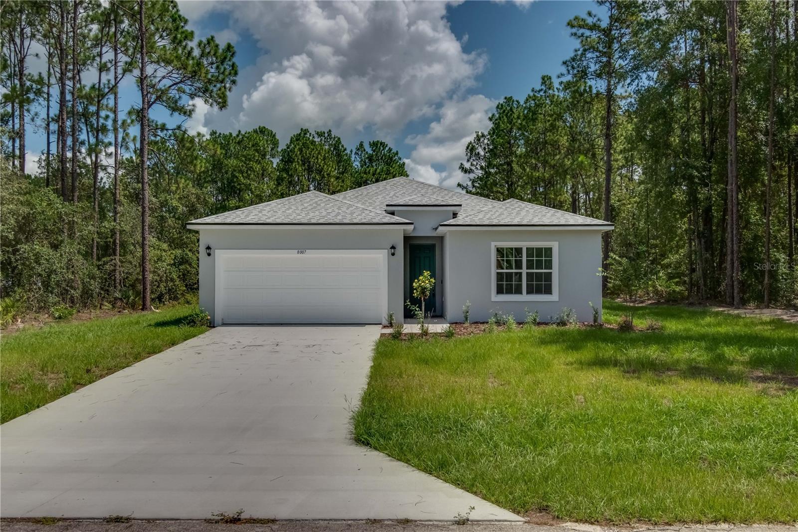 MUST SEE - NEW Construction, just completed on this 2023 built concrete block 4-bedroom 3-bathroom 2 car garage home on a prime centrally located oversized corner lot close to I75 and HWY 484! Standout features include upgraded stainless-steel Samsung appliance package, water and scratch resistant Revwood flooring in the common areas, Sparkling White Quartz countertops, 9'4'' ceilings throughout, and 8' front door. The owner's retreat features His/Her walk-in closets, dual sink vanity, flooring to ceiling tile shower, and tray ceiling. Both Guest bathroom showcase shower/tub combos with modern tile. Guest Bedroom with private en-suite bathroom is perfect for a guest room or can be used as in-laws room. Indoor laundry room with washer and dryer included. You will fall in love with this modern, light and bright, open layout floor plan. Call today for your private showing this home will not last!