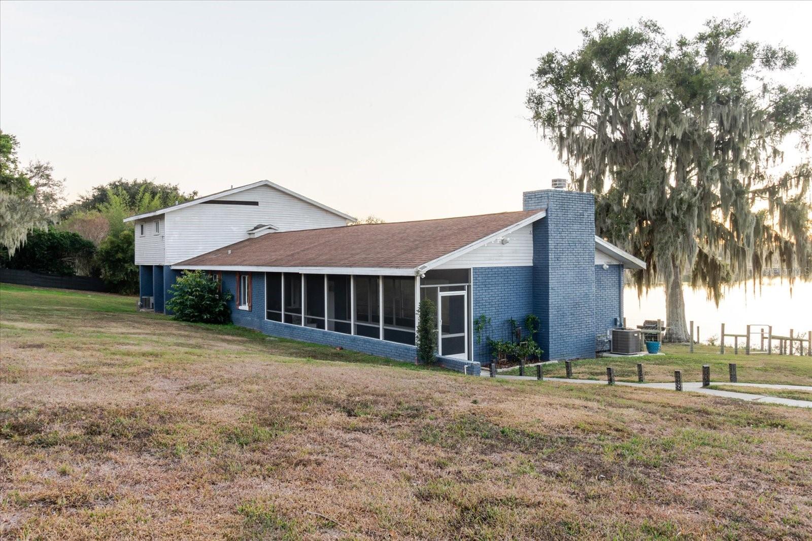 Welcome to 2120 Hurley Dr! This beautifully maintained home offers comfort, space, and privacy on over 1 acre of waterfront land. Enjoy a bright, open living space with great natural light, a practical layout, and well-sized rooms throughout. Upon entry, you’ll love the reflective window tint all throughout the front walkway leading into the living room, offering added privacy while improving energy efficiency and helping keep the heat out. The living room features a functioning fireplace, creating the perfect cozy gathering space. The primary bedroom provides a relaxing retreat, featuring new flooring on the steps leading up to the primary bedroom, adding a fresh, updated touch. Step outside to your own oasis with a private enclosed pool, perfect for entertaining, relaxing, or enjoying Florida living year-round—while taking in the beautiful sunsets you’ll enjoy from your own property. Home also includes a full LTS home security system with easy transfer to the new owner. The system is self-operated, hardwired, and can connect to a computer or TV screen, with access available both in-home and through a mobile device for added convenience and peace of mind. This home is Conveniently located near shopping, dining, schools, and major roadways. Furnishings available upon request. Don’t miss this rare opportunity—schedule your private showing today!