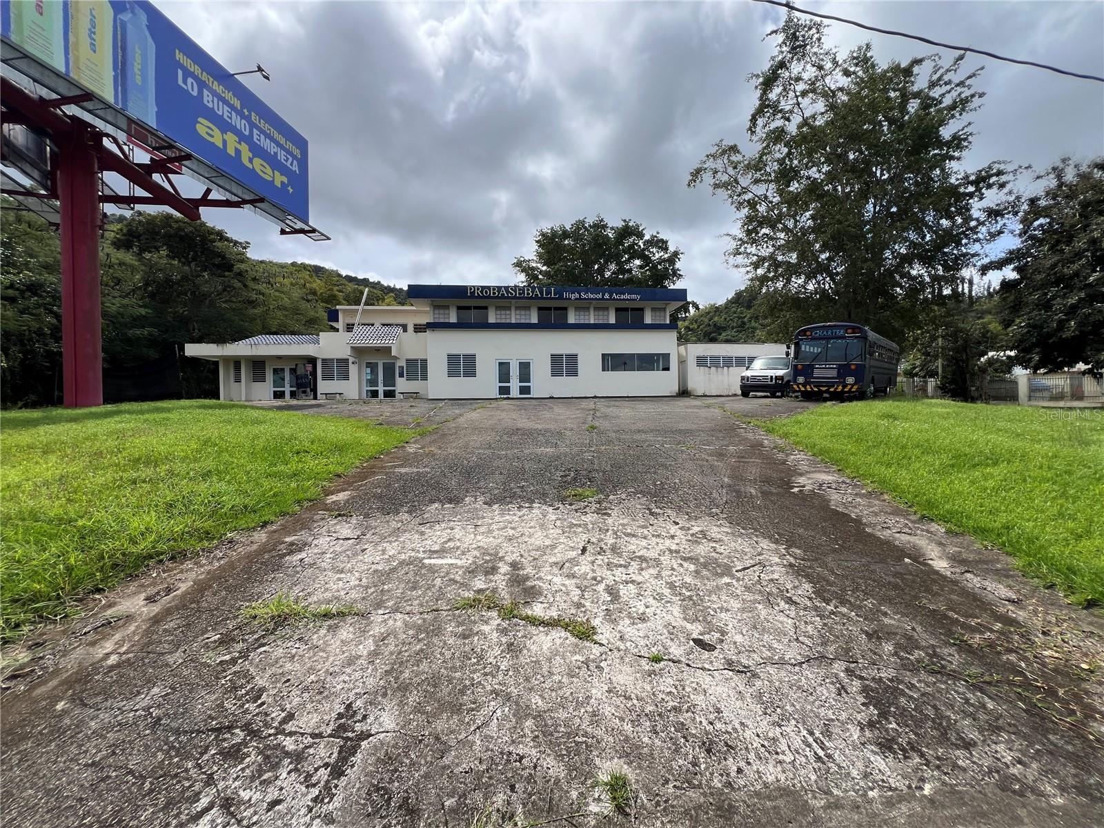 Commercial Opportunity in Cayey

Two-story commercial property with excellent visibility from PR-52 and convenient access from Exit #39 (San Juan–Cayey direction). Its strategic location makes it an outstanding opportunity to establish, expand, or relocate your business.

The property offers approximately 6,079 square feet of building area on a 4,766-square-meter lot, providing ample space for parking, future expansion, or additional improvements. It also includes a leased billboard that generates rental income for the owner, adding immediate investment value.

Originally designed as an educational facility, the layout includes multiple classrooms, offices, a reception area, kitchen, laundry area, bathrooms, and dormitory-style rooms. Each classroom has its own private exterior entrance while maintaining interior access, offering exceptional flexibility for a wide variety of commercial uses.

Ideal for educational institutions, professional offices, medical or therapy centers, daycare facilities, nonprofit organizations, training centers, assisted living facilities, or any business requiring generous space and outstanding visibility.

A property that combines a strategic location, versatile layout, development potential, and an additional income-producing asset. Schedule your private tour today.