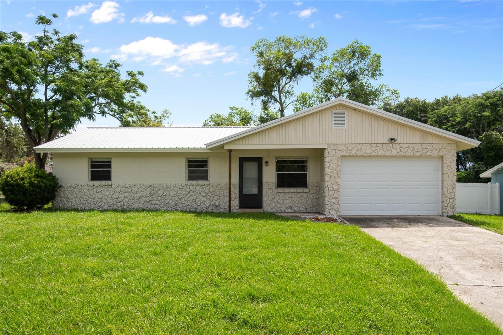 Nestled in a quiet DeBary neighborhood, this beautifully updated 3-bedroom, 1-bathroom home with 2-car garage offers comfort, convenience, and exceptional value. Situated on a corner lot, this move-in-ready home features fresh interior and exterior paint, and brand-new luxury vinyl plank flooring. No carpet in the home.

Inside, you'll find a bright and inviting living space that flows seamlessly into three comfortable bedrooms. The fresh updates and functional layout create a clean, modern feel while maintaining the home's charm and practicality.

Step outside to enjoy the oversized screened porch overlooking a fully fenced backyard with newly installed flooring—perfect for relaxing, entertaining, or enjoying outdoor activities. Lawn care is included in the monthly rent, allowing you to enjoy the yard without the maintenance responsibilities.
With its recent updates, fenced yard, included lawn service, and convenient DeBary location, this home offers an outstanding rental opportunity.

Don't miss your chance to make this beautifully updated home yours—schedule your private showing today! 

First Month Rent & Security Due at Lease Signing. Tenant(s) subject to approval process.
