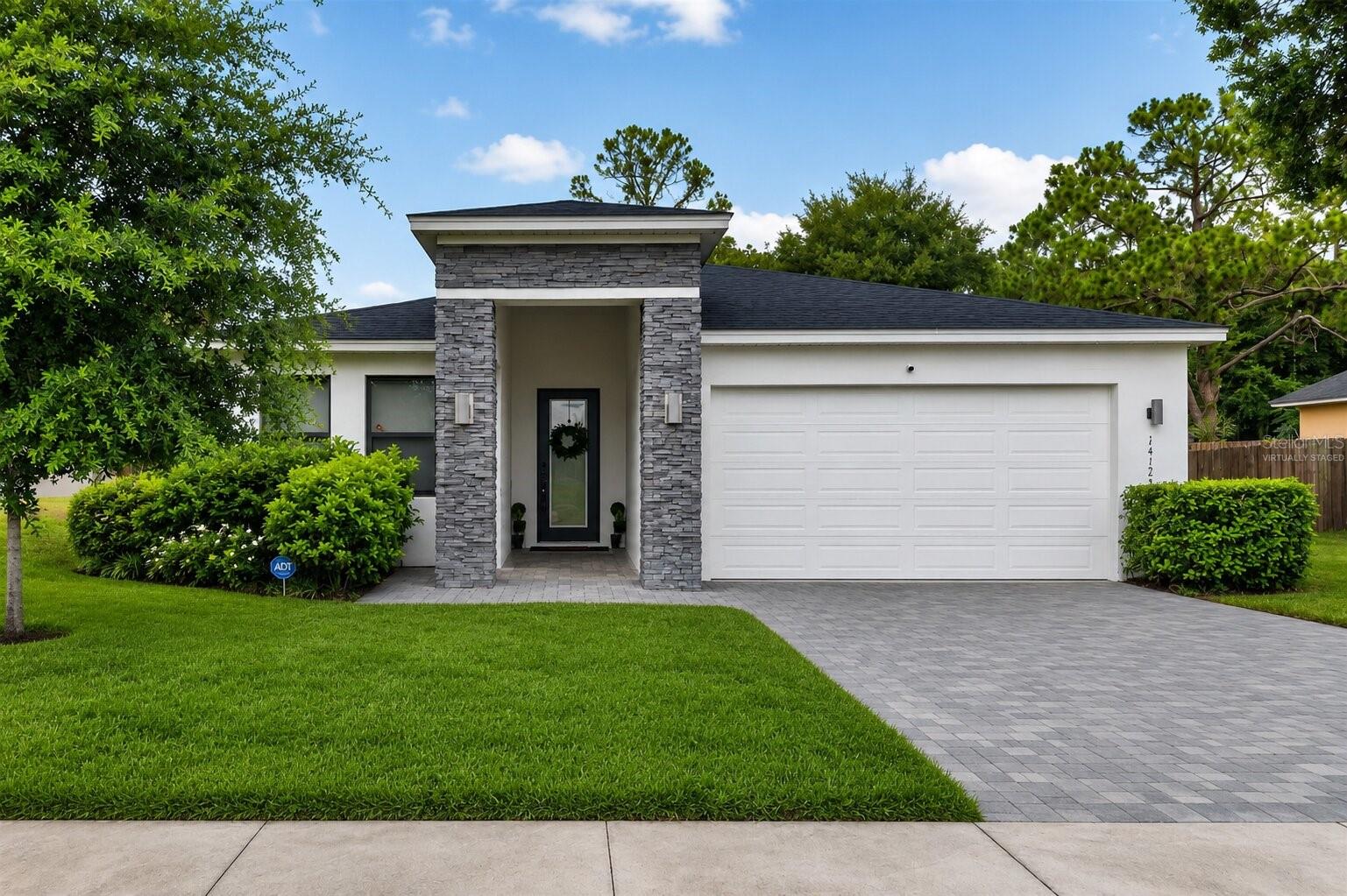 Virtually Staged. Welcome to this beautiful newer-construction home built in 2023, offering modern style, quality finishes, and the freedom of NO HOA! Situated on a spacious, fully fenced 0.33-acre lot, this 4-bedroom, 2.5-bath residence features 1,916 square feet of thoughtfully designed single-story living space.

Step inside to an open-concept floor plan enhanced by ceramic tile and engineered hardwood flooring throughout. The gourmet kitchen is the heart of the home, showcasing quartz countertops, an oversized island perfect for gathering and entertaining, stainless steel appliances, decorative backsplash, deep farmhouse sink, pendant lighting, and recessed lighting.

The spacious primary suite offers a private retreat with a walk-in closet and a luxurious en-suite bathroom featuring dual vanities and a glass-enclosed shower. Three additional bedrooms provide flexibility for family, guests, or a home office.

Additional highlights include an indoor laundry room complete with washer and dryer, modern finishes throughout, and plenty of outdoor space for pets, gardening, entertaining, or future additions.

Conveniently located approximately 30 minutes from UCF, with easy access to major roadways, shopping, dining, and everyday conveniences. Don't miss this opportunity to own a nearly new home with no HOA restrictions and room to enjoy Florida living at its best!
