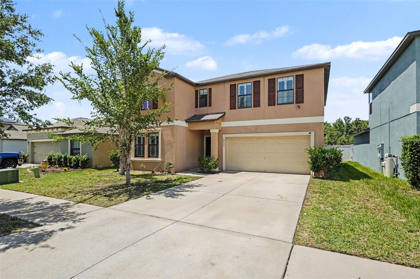Welcome to 10022 Carloway Hills, where space, comfort, and convenience come together in this beautifully designed home. Featuring an open floor plan with 6 bedrooms, 3 full bathrooms, and a 2-car garage, this home offers plenty of room for family and guests. Enjoy added privacy with a fully fenced backyard and no rear neighbors. The spacious kitchen is the heart of the home, complete with a center island with breakfast bar seating, abundant cabinetry, and ample space for a large dining table—perfect for everyday living and entertaining alike. Designed for both privacy and functionality, the first floor includes two bedrooms, including the primary suite, which features an en-suite bathroom. Upstairs, you'll find a generous 20' x 20' loft/bonus room, ideal as a media room, home office, playroom, or workout space, along with four additional bedrooms to accommodate a growing family or visiting guests. Step outside to the screened and covered lanai, the perfect spot to enjoy your morning coffee or unwind in the evening. Just beyond, an extended brick paver patio provides an ideal setting for outdoor grilling and entertaining. Residents enjoy access to an impressive community center featuring two swimming pools, a basketball court, gymnasium, and a variety of additional amenities designed for an active lifestyle. Conveniently located in the growing community of Wimauma, this home is just minutes from major grocery stores, restaurants, hospitals, and Apollo Beach. With easy access to I-75 and US-301, commuting to Tampa International Airport, MacDill Air Force Base, and the greater Tampa Bay area is a breeze. The community offers a low HOA fee, with the CDD conveniently included in the annual property tax bill. This exceptional home offers the perfect blend of space, comfort, and lifestyle. Schedule your private showing today!