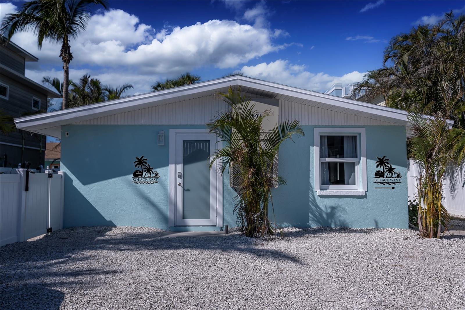 OVER 150K INCOME OVER LAST 12 MONTHS!!!  Embrace the pinnacle of island luxury with this impeccably designed, turnkey Holmes Beach duplex—operating as a successful Airbnb and ready for seamless ownership transition. Each side features two spacious bedrooms and one bath, complete with gleaming marble countertops, white shaker cabinetry, elegant, natural-flow tile backsplashes and breathtaking remodeled bathrooms. With fresh paint, brand-new flooring, and a 2022 roof, the home is both stunning and secure. Every door and window is hurricane-rated and newly installed—offering peace of mind in every detail.

Outdoors, one side boasts a heated pool with newly installed heater and a gorgeous waterfall feature, while the other side offers a soothing hot tub just installed in 2025 as well. Two outdoor showers add to the coastal experience, surrounded by lush, meticulously maintained landscaping. With five parking spots and separate entrances, you can host larger groups as a whole or individual parties in each unit and your guests will fall in love with this location when they find out public beach access is less than a block away!

This duplex is uniquely positioned for maximum rental flexibility. Weekly rentals are fully allowed, making this a prime investment. High-end furnishings down to the last detail—silverware, plates, bedding, towels—ensure a seamless guest experience. Just steps from the vibrant charm of historic Bridge Street—known for its waterfront dining, boutique shops, and lively atmosphere—and minutes from the serene Bean Point, this property is at the heart of one of Florida’s top destinations.

This is more than a home; it’s a fully operational, luxurious escape. Whether you’re continuing its rental success or claiming it for yourself, this is an unparalleled opportunity for coastal living and investment combined.