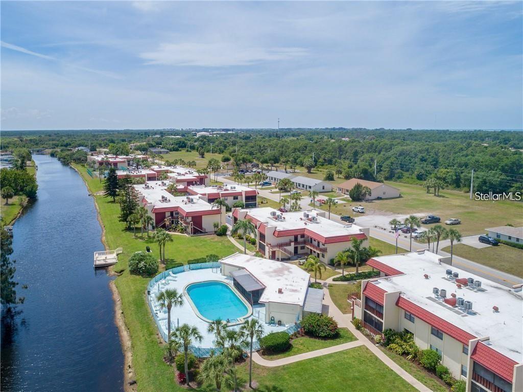 Take advantage of incredible pricing on this stunning second-floor sanctuary where expansive WATERFRONT VIEWS meet the epitome of relaxed FLORIDA LIVING. Tucked away in the sought-after Riverhouse community of Rotonda West, this charming one-bedroom, one-bathroom residence serves as the quintessential retreat for those seeking tranquility or a sun-drenched second home. Elegant TILE FLOORING stretches throughout the space, reflecting the abundant NATURAL LIGHT and creating a bright, open atmosphere that feels both clean and modern. The heart of the home is the inviting dining area, where you can savor every meal against the serene backdrop of the Rotonda River. For moments of true relaxation, step onto your PRIVATE SCREENED PATIO; equipped with a ceiling fan for that extra breeze, it is the perfect spot for morning coffee, bird watching, or cultivating a lush container garden. Practicality meets comfort in the OVERSIZED BEDROOM, which offers ample closet space complemented by additional hallway storage. Beyond the front door, the Riverhouse lifestyle awaits with twoSPARKLING POOLS (one heated), a welcoming clubhouse with a kitchen and library, sports courts, and a private community fishing dock. Golf enthusiasts will thrive with five championship courses nearby, while the community park offers picturesque walking trails, a playground, and BBQ areas. Located just minutes from the boutique shopping and dining of Englewood and the world-class beaches of Boca Grande, this idyllic condo is a rare find that perfectly captures the essence of coastal convenience. COntact us today for your exclusive showing and start living your BEST Florida life!
