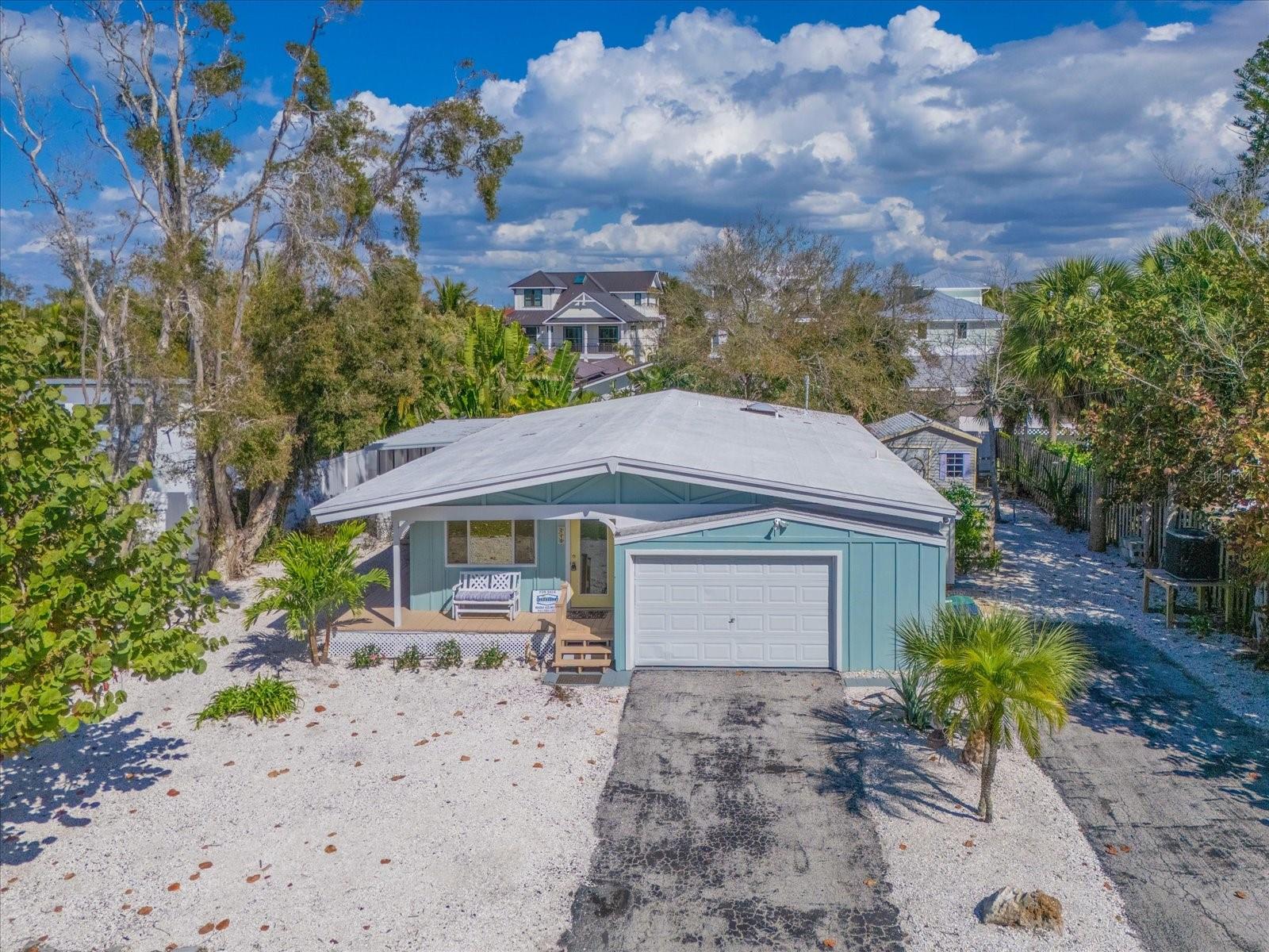 Virtually Staged. Lowest priced 3 bedroom home currently available on the north end of Anna Maria Island.

Located in the City of Anna Maria, where short term rentals are permitted with a 1 to 7 day minimum subject to city registration and compliance, this beautifully updated island home presents an exceptional opportunity to own in one of the most sought after locations on the island.

This inviting single level residence offers 3 bedrooms, 2 renovated bathrooms, and a versatile den or mudroom. Vaulted tongue and groove wood ceilings create warmth and character throughout the main living space, while the redesigned kitchen features updated cabinetry, countertops, and newer appliances. New flooring throughout the home complements the bright coastal feel and move in ready condition.

Set on an oversized 7,500 square foot lot, the property offers something increasingly difficult to find on the north end of Anna Maria Island: space. Whether you envision a custom pool, outdoor kitchen, tropical entertaining area, or your own private backyard retreat, there is ample room to create the outdoor lifestyle buyers dream about when moving to the island. A current survey is available to assist with future planning.

The primary suite opens to a private porch, perfect for morning coffee or evening relaxation, while the expansive screened porch extends the living space outdoors and provides the ideal setting for entertaining family and friends year round.

Additional features include a new AC system installed in 2025, a one car garage, outdoor shower, storage shed, fenced yard, mature tropical landscaping, and generous off street parking, a rare and valuable feature on the north end.

The location is truly exceptional. Walk or bike to Pine Avenue’s charming shops, restaurants, and cafes. Bayfront Park, Bean Point, and some of Anna Maria Island’s most beautiful beach accesses are all nearby, allowing you to enjoy the very best of island living without ever needing to get in your car.

Whether you are searching for a full time residence, seasonal getaway, investment property, or future island retreat, this home offers an outstanding combination of location, flexibility, and value. At $1,290,000, it represents one of the most compelling opportunities currently available on the north end of Anna Maria Island.

Come experience the island lifestyle that continues to make Anna Maria one of Florida’s most treasured coastal communities.
