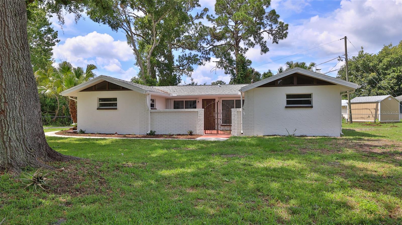 Your Turn-Key Florida Dream Awaits! Say goodbye to fixer-uppers and hello to this stunning, completely remodeled 3-bedroom, 2-bathroom block home situated on a spacious corner lot in lovely Florida Shores. Boasting 1,430 sq. ft. of thoughtfully upgraded living space, this home features brand-new vinyl and tile flooring throughout—completely carpet-free! The heart of the home is a gorgeous, fully renovated kitchen equipped with brand-new appliances, sleek countertops, and modern cabinetry. Both bathrooms have been beautifully transformed with contemporary finishes. Enjoy the ultimate freedom of no HOA restrictions on your expansive lot, perfect for storing toys, boats, or creating an outdoor oasis. Located just a short drive from the beach, dining, shopping, and local amenities, this move-in-ready gem offers the perfect Florida lifestyle. Schedule your tour today! All information is deemed accurate but not guaranteed.