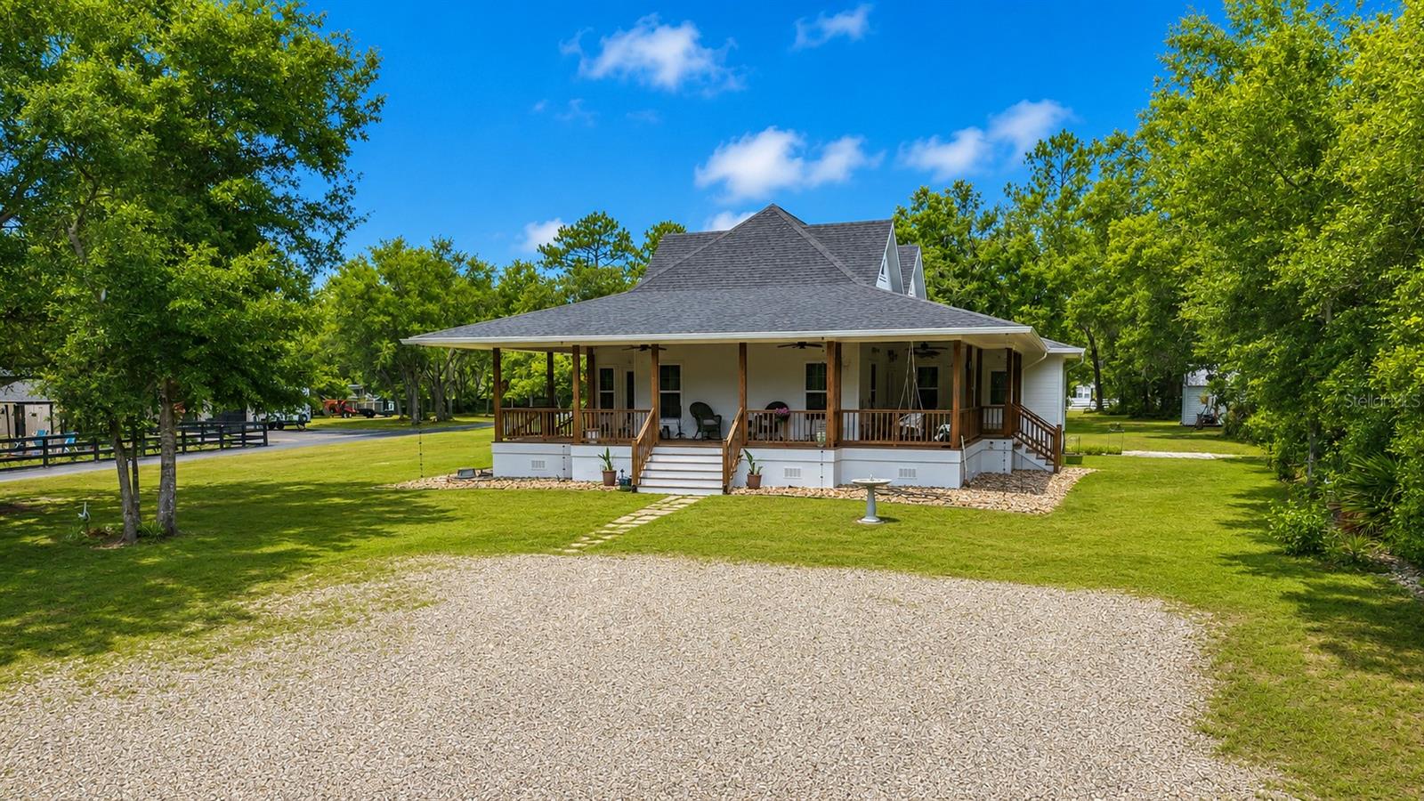 Welcome to your own private slice of the Nature Coast! Built in 2020 and beautifully refreshed with new interior and exterior paint in 2025, this stunning home offers over 2,600 AC square feet and 3676 under roof of bright, open living space on more than 2.3 peaceful acres—all just minutes from the heart of Crystal River. Step onto the spacious, welcoming front porch and into a home filled with soaring ceilings, abundant natural light, and thoughtful upgrades throughout. The completely renovated kitchen is a showstopper, featuring new countertops, updated appliances, ample cabinetry, and a walk-in pantry that's ready for everything from weeknight dinners to holiday entertaining. Designed with flexibility in mind, the home features two spacious primary suites, making it ideal for multi-generational living, guests, or anyone who appreciates extra comfort and privacy. The main primary suite has been beautifully updated with dual vanities, an oversized walk-in shower, and a massive walk-in closet complete with custom organizers. Need additional space? The formal dining room was designed to serve as an optional fourth bedroom, giving you the flexibility to create a home office, playroom, or guest suite to fit your lifestyle. A separate laundry room adds convenience, while the open floor plan makes everyday living and entertaining effortless. If you've been searching for modern construction, room to spread out, and a move-in ready home with acreage, this one checks all the boxes. Enjoy the peace and privacy of country-style living while being centrally located to shopping, restaurants, medical facilities, boat ramps, and all that Crystal River has to offer. This is the perfect place to relax, entertain, and enjoy the Florida lifestyle you've been dreaming of!