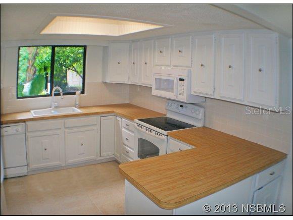NEWLY REMODELED KEY WEST STYLE BEACH HOUSE- VERY LOW MAINTENANCE AND LOW HOA ONLY $143/MONTH! Metal roof, Caribbean colors, white vinyl privacy fenced yard, extensive tropical landscaping. A short walk to the best beach in Central Florida. Only 1-block to Indian River Lagoon Preserve Park to go fishing, kayak, and view manatees and dolphins. Interior remodeled in 2013: ALL NEW APPLIANCES, NEW LAMINATE WOOD FLOORS, NEW TILE FLOORS AND BATHROOMS, ALL NEW DOORS AND FRESHLY PAINTED WALLS. Exterior Hardi-panel walls with stucco finish have 50 year warranty- resists mold & termites. LOW HOA covers insurance and maintenance. AFFORDABLE, RENTABLE, & BEAUTIFUL!!  Your newly remodeled beach house is ready to move in today! ;Water: City