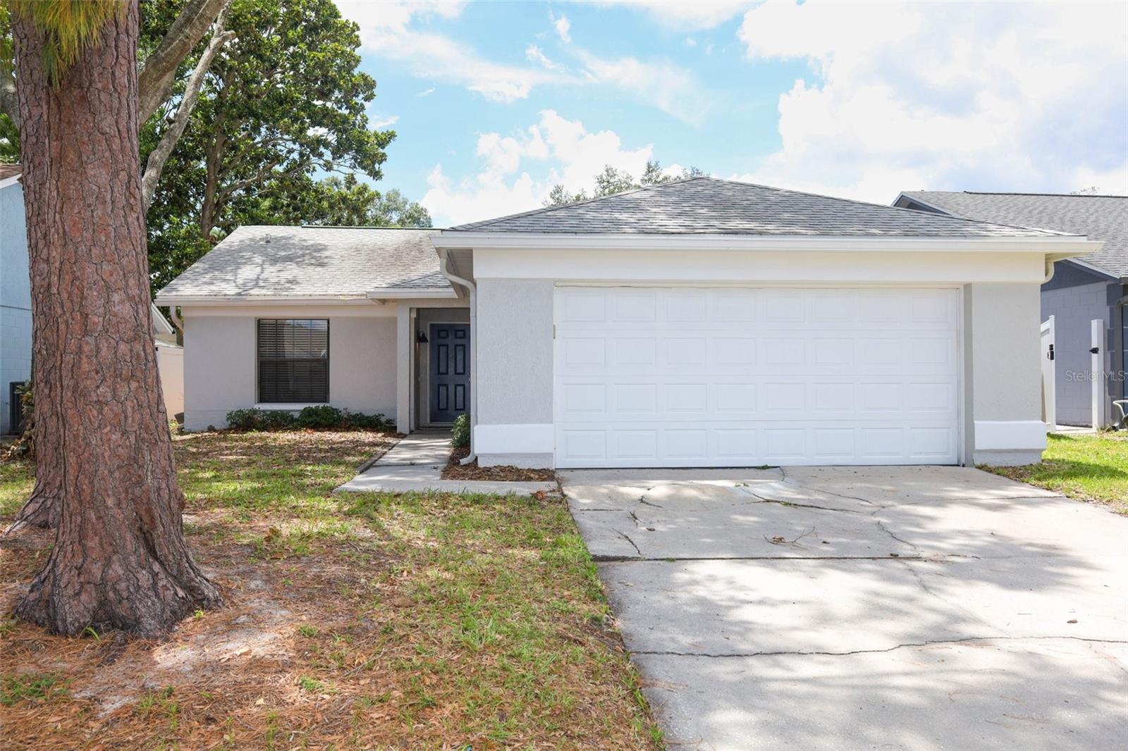 Virtually Staged. Welcome to this 3-bedroom, 2-bath home located in the established Alafaya Woods community of Oviedo. Featuring a functional layout with vaulted ceilings and a true split floor plan, this home offers both comfort and privacy, with the primary suite situated on one side of the home and the secondary bedrooms on the other. The formal dining area provides an ideal setting for gatherings, while the fully fenced backyard offers privacy and space to enjoy the outdoors. Recent improvements include an updated primary bathroom, adding a fresh and modern touch to the owner's retreat. A brand-new roof is currently in the permitting process and will be completed prior to closing, providing significant value and peace of mind for the next owner. Conveniently located near the community park featuring basketball courts, tennis courts, and a playground, and just minutes from UCF, Waterford Lakes Town Center, major roadways, shopping, dining, and everyday conveniences. Situated within Seminole County's highly regarded school district, this property presents an excellent opportunity to own in one of Oviedo's most established and desirable communities.