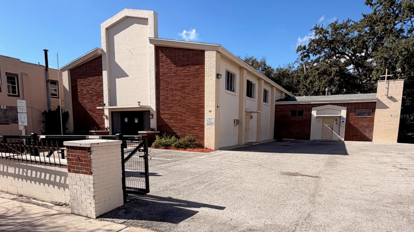 In Downtown Orlando’s prime growth corridor, this (3) three-parcel package is within an Opportunity Zone and HUBZone (buyer to verify), which may provide incentive potential for qualified buyers. The site totals .68 ac (11,234 SF) and includes two buildings plus a vacant lot. Starting with 514 S. Parramore Ave., the property features 5,848 SF assembly building with an approximately 200-seat sanctuary. 512 S. Parramore Ave. includes an occupied 5,386 SF building currently used as a school, featuring four classrooms and office space upstairs. 504 S. Parramore Ave., a vacant .20 ac lot is included in the package and provides added flexibility for future expansion or use. This offering supports continued institutional use, adaptive reuse, or full redevelopment as the surrounding area continues to see neighborhood revitalization and new investment. Located minutes from Inter&Co Stadium, Kia Center and Camping World Stadium, this property offers a tremendous opportunity to be a part of the redevelopment that's occurring in one of America's fastest growing cities.
