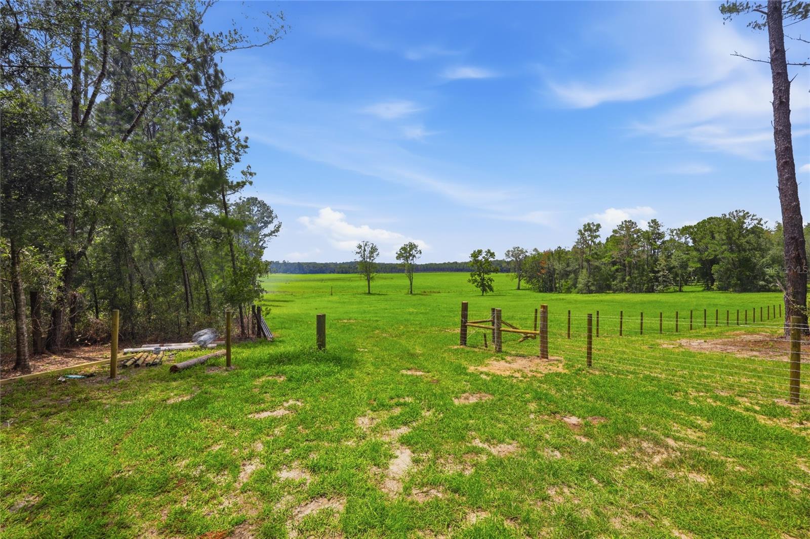 Discover the perfect place to build your future home on this thoughtfully cleared, 5-acre homesite overlooking a beautiful 300-acre cattle farm.  Enjoy plenty of room to spread out and enjoy life in the country. Relax as you take in breathtaking sunsets and watch deer roam the property. Conveniently located just minutes from Alachua, High Springs, Gainesville, I-75, and US 441. You'll be close to natural springs, rivers, and state parks with endless opportunities for fishing, kayaking, and swimming for exploring the outdoors. Whether you're ready to build your dream home or create your own country getaway, this property is ready for your vision.