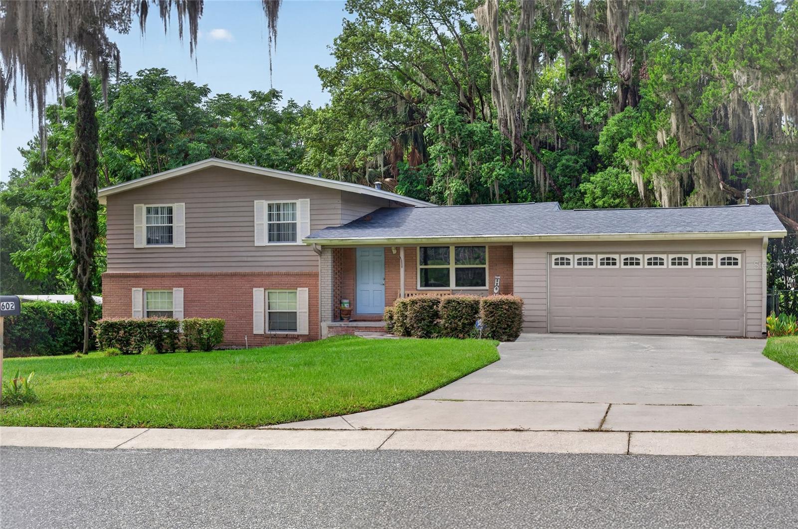 Amazing home in a prime location in the heart of Ocala, just minutes from downtown! This charming 3-story home offers 1,944 square feet of living space with 3 bedrooms and 2.5 bathrooms, full of character and charm. The main level features a beautifully updated kitchen with granite countertops, a center island, newer appliances, a convenient half bath, and sliding glass doors that open to a 20 X 20 wood deck overlooking a private, fenced backyard. The lower level includes a private mother-in-law suite with its own entrance, carport, 1 bedroom, and 1 bathroom, making it ideal for extended family, guests, or rental potential. The top floor offers three bedrooms and a full bathroom. Conveniently located near hospitals, restaurants, shopping, and everything downtown Ocala has to offer, this home also features a new roof installed in 2022. Don't miss this incredible opportunity and schedule your private tour today!