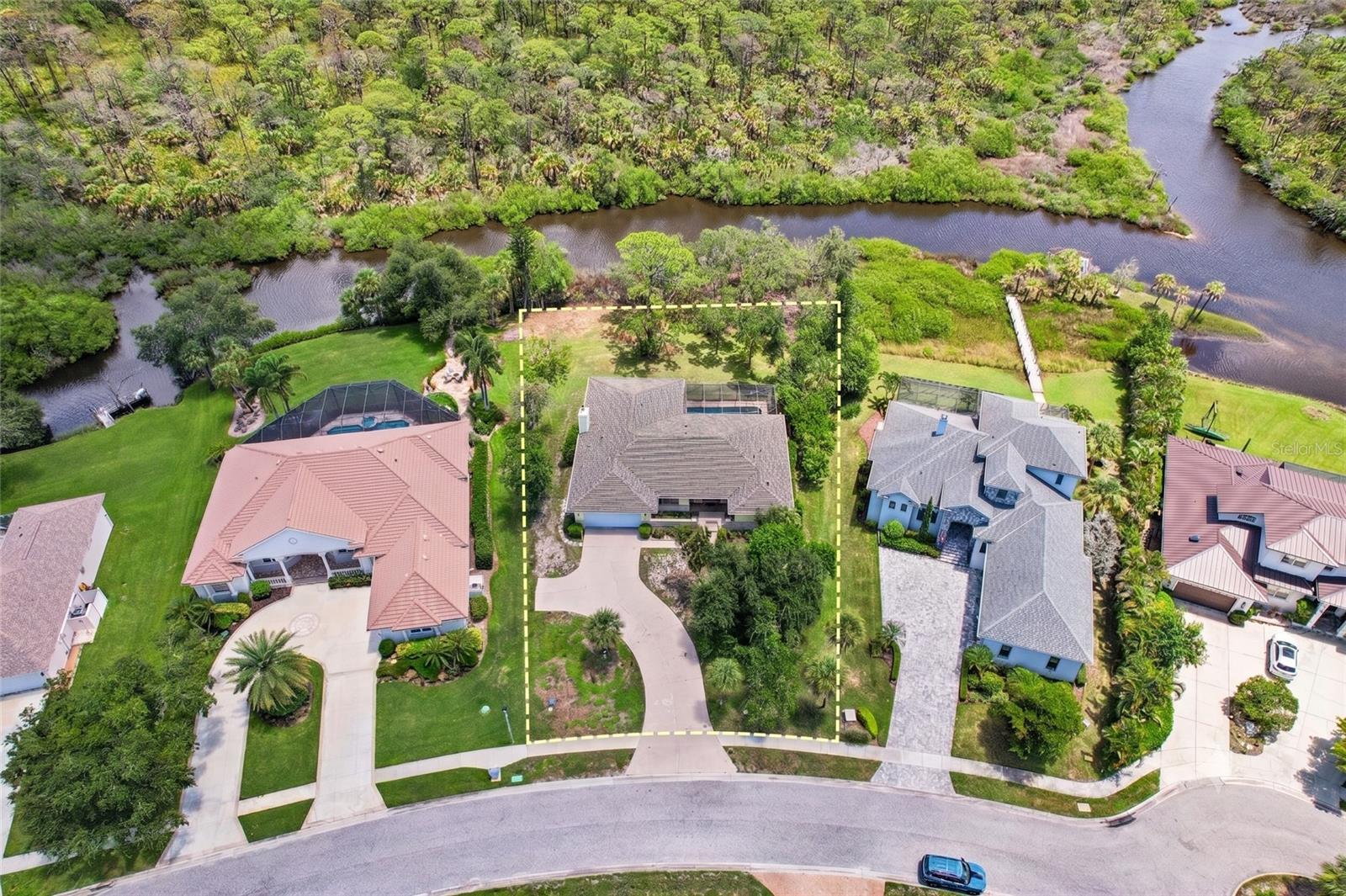 Virtually Staged. RIVER VIEWS! A rare waterfront find in Nokomis, this solid poured-concrete home sits on an elevated foundation with spacious rooms and classic craftsmanship that would easily cost over a million in Lakewood Ranch. Nestled on a sprawling lot in a timeless neighborhood with fantastic neighbors, the tranquil setting features serene creek views framed by trimmed mangroves.  Cool off and enjoy the summer breeze in the Large screened-in lanai or the newly resurfaced pool with its freshly rescreened cage.  While offering a wonderful opportunity to add your own cosmetic TLC, the heavy lifting is already done with major recent updates, including a new roof, a brand-new A/C system, a new dishwasher, and a true carpenter’s garage complete with built-ins throughout and an expansive driveway. Inside, enjoy comfortable living anchored by a cozy fireplace and a clever Jack-and-Jill bathroom that conveniently serves the pool. Perfectly situated just minutes from three beach accesses, public-friendly golf courses with no membership fees, and the new Sarasota Memorial Hospital, this home combines major peace of mind, ultimate convenience, and exceptional waterfront value.