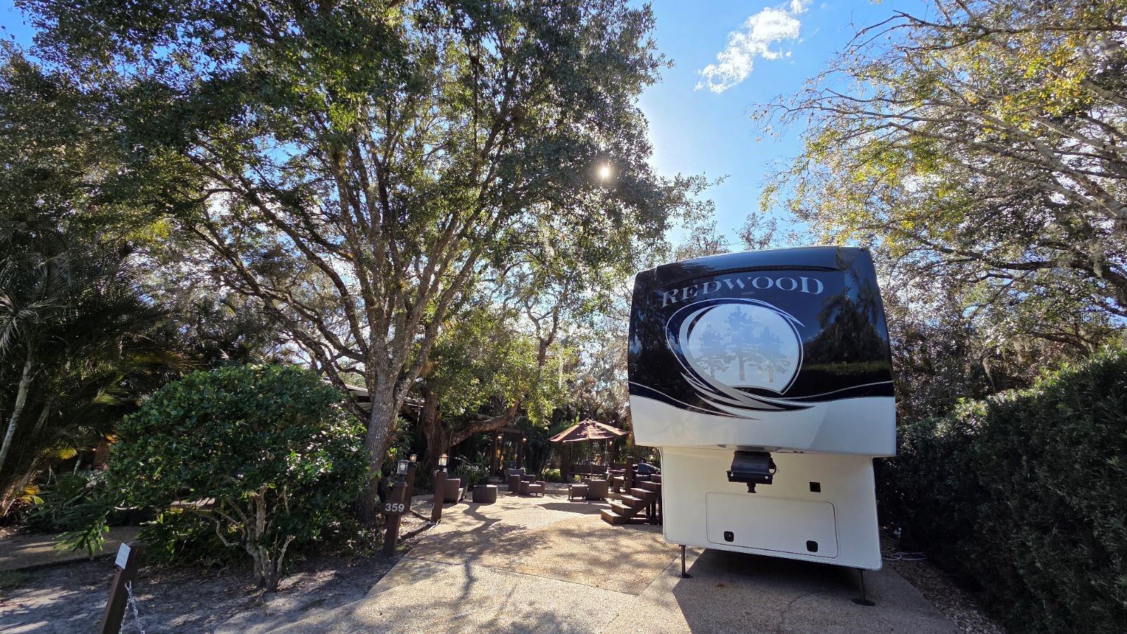 Buy an RV Lot in a Luxury Resort in CENTRAL FL!  RARE PHASE 3 OPPORTUNITY WITH NO REAR NEIGHBORS! Welcome to Lot 359 in the premier River Ranch RV Resort. This oversized, fee-simple deeded lot is a hidden gem shaded by magnificent, mature Grand Oaks, offering a serene and private atmosphere that is hard to find.  Located just steps from the Phase 3 bathhouse and laundry facilities, this lot combines convenience with massive potential. The spacious footprint provides ample room to extend your living area, with plenty of space to add a large pavilion, full-size storage shed, and a custom outdoor kitchen/fireplace setup.  Ownership includes access to all private RV resort amenities plus the world-famous Westgate River Ranch Resort & Rodeo attractions, including the petting zoo, marina, adventure park, and the new water park. HOA fee of $942/quarter includes water, cable, sewer, trash, lawn maintenance, and gated security. Whether you are looking for a weekend retreat or a full-time luxury home base, Lot 359 is the perfect canvas.  LIVE THE RESORT LIFE: Saturday Night Rodeo & Saloon dancing Adventure Park, Airboats, & Arcade, NEW Water Park + Pools & Mini Golf, Starbucks, BBQ, Pizza, & Ice Cream on-site!