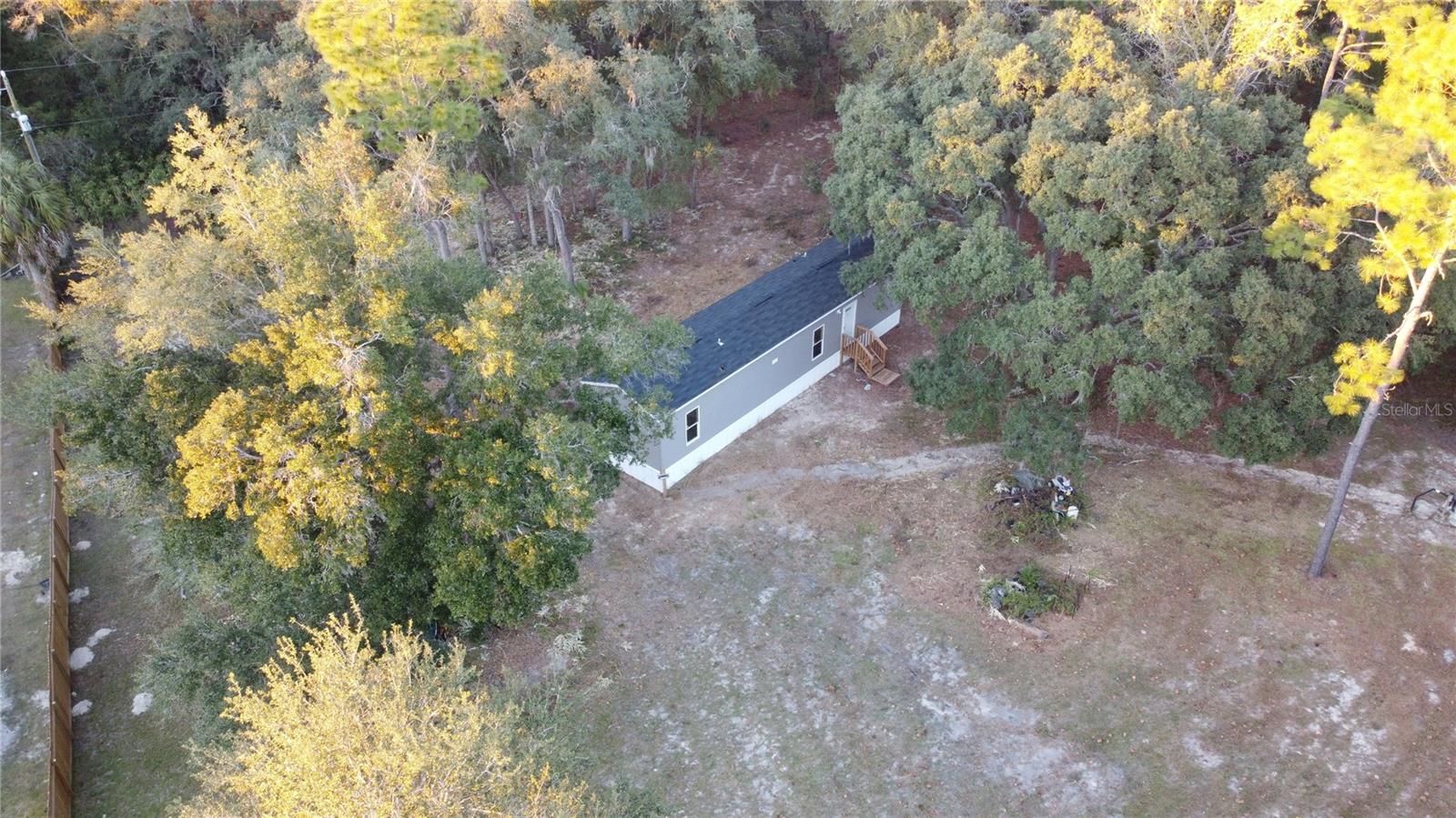 PRICED TO SELL! BRAND NEW MH on nearly 1 ACRE in quaint community of Morriston. Fenced & gated property canopied with large granddaddy oaks includes NEW WELL, SEPTIC, HVAC & ALL APPLIANCES! Short drive to larger cities (Ocala, Dunnellon, Gainesville). HIGH & DRY, NO HOA or CDD! Call today and be on your way to owning a slice of pure Florida !