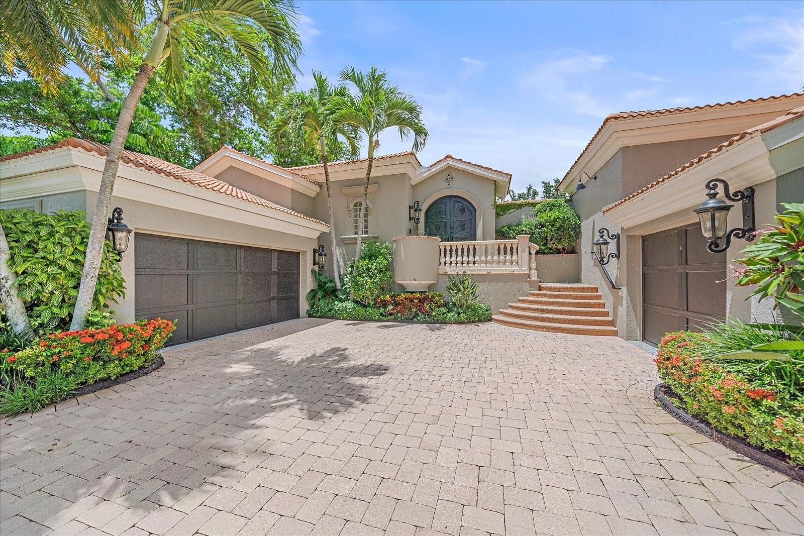 Motivated seller! Listed below current appraised value. This one-of-a-kind, fully renovated residence is nestled in the heart of Sarasota’s historic McClellan Park—just steps from the bayfront, downtown, and Southside Village. Set on an elevated lot, the home experienced no flooding or storm damage during last year’s storms. Originally built by a builder as his personal home and reimagined in 2022 by the previous owner, an interior designer, the property showcases timeless elegance, custom finishes, and exceptional privacy. Beyond hand-forged iron gates lies a tranquil travertine courtyard with a heated pool, cascading spa, bistro lighting, full outdoor kitchen, and a detached guest suite. Inside, the main home offers a chef’s kitchen with top-of-the-line Miele appliances, custom cabinetry, and stone countertops, along with spacious living and dining areas featuring marble floors, coffered ceilings, and expansive pocket sliders for seamless indoor-outdoor living. The luxurious primary suite includes French doors to a private balcony, designer touches throughout, dual walk-in closets, and a spa-like Carrera marble bath with soaking tub and walk-in shower. Recent upgrades in 2024 include a brand-new AC system, whole-house water softener, and all new light fixtures. Additional highlights include a private library or office, 3-car garage, Lutron lighting system, Sonos audio, security cameras, handicap-accessible entry, and lush, low-maintenance landscaping.