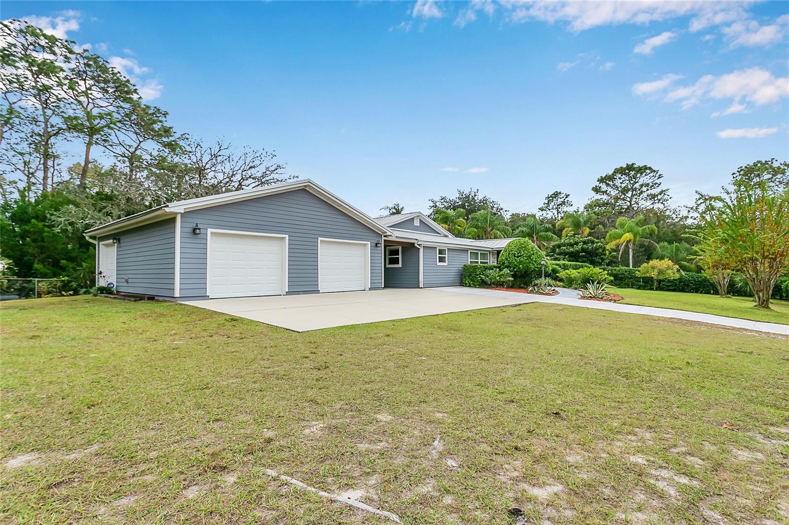 Stunning 4 Bedroom | 3 Bath Move-In Ready Home on Oversized Lot Backing to Florida State Forest & Trail System Experience exceptional privacy and premium upgrades in this beautifully designed home set on an oversized lot bordered on two sides by protected state forest land and the extensive FL Trail system—offering direct access to miles of natural Florida hiking and biking right from your property. All updates and finishes were thoughtfully completed by the previous owner, a professional contractor, ensuring high-quality craftsmanship, attention to detail, and lasting value throughout the home. Inside, a thoughtful split floor plan places the owner’s suite, gourmet kitchen, and a spacious family room on one side of the home, with the remaining bedrooms on the other for maximum privacy. A separate bonus room just off the mudroom provides a quiet and versatile space for an office, hobby room, or flex space. The chef-inspired kitchen features Samsung appliances, gas stove, quartz countertops, abundant cabinetry, and a large bar seating area. Two generous living/entertaining rooms anchor the home, separated by a dramatic solid barn door. One includes a custom wet bar with sink and dual beverage coolers—perfect for hosting. Interior Features Porcelain wood-plank tile throughout Ceiling fans in all rooms Recessed LED lighting with WiFi-enabled dimmers High-efficiency HVAC & water heater, both WiFi-controlled Whole-house water filtration & softener system with RO at the kitchen sink Large laundry + utility room, plus mudroom with extra storage Exterior & Outdoor Living This property is crafted for year-round outdoor enjoyment. A breezeway connects the house and oversized 3-car garage, creating another covered lounge area with beautiful tongue-and-groove ceilings—featured across all five covered outdoor patios for a premium, cohesive look. The resort-style outdoor space includes: In-ground pool with sun shelf and water features Brand-new pavers throughout the entire pool deck and patio area (over 1,500 sq ft) 12' x 20' covered cabana with full electric, T&G ceiling, and dual fans Back patio with 8' glass doors and T&G ceiling Expansive front and rear yards with a large fire pit Separate fenced garden area with custom-built chicken coop Property & Construction Highlights Standing-seam galvalume metal roof with long-term warranty Hardie Board lap siding covering exterior Vinyl double-pane, energy-efficient windows Entire property fully fenced with 16' aluminum entry gate and two additional access gates Large driveway with ample parking Premium Therma-Tru front door; all locks keyed alike Location Enjoy peaceful, quiet living on a 3-mile dead-end, golf-cart-friendly road lined with large ranches, oak trees, and abundant wildlife—just minutes to downtown Oviedo, restaurants, and shopping. Convenient access to downtown Orlando and Orlando International Airport. Zoned for A+ rated schools. Bordered by protected land with direct trail access and packed with high-end upgrades inside and out, professionally executed by a contractor-owner, this home offers an unmatched blend of privacy, craftsmanship, comfort, and convenience.