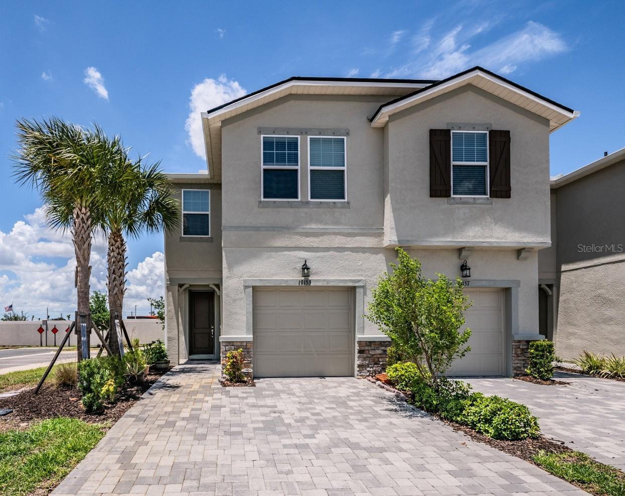 THIS MOVE-IN READY CORNER-UNIT HOME OFFERS MODERN FINISHES, FLEXIBLE LIVING SPACE, AND ACCESS TO RESORT-STYLE AMENITIES IN ONE OF LUTZ’S MOST CONVENIENT LOCATIONS.  Whether you’re a first-time home buyer, relocating to the Tampa Bay area, or searching for a strong rental investment opportunity, this beautifully maintained 3-bedroom, 2.5-bathroom townhome checks all the boxes.  Built in 2022, this spacious townhome offers nearly 1,700 square feet of thoughtfully designed living space with an open-concept floor plan perfect for everyday living and entertaining.  The modern kitchen features quartz countertops, stainless steel appliances, upgraded cabinetry, pantry storage, and a large island overlooking the living and dining areas.  Sliding glass doors lead to a screened rear lanai, creating the perfect indoor-outdoor space to relax or entertain guests.  Upstairs, the oversized loft provides flexible space ideal for a home office, media room, playroom, gym area, or second living space.  The spacious primary suite includes multiple walk-in closets, dual sinks, and a large walk-in shower, while the secondary bedrooms are privately positioned across the loft for added separation and functionality.  Additional highlights include upstairs laundry, recessed lighting, ceiling fans, hurricane shutters, and an attached garage, all in a secure. gated community.  Residents enjoy access to Parkview at Long Lake Ranch amenities including a community pool, a dog park, playgrounds, and parks, along with additional Long Lake Ranch amenities featuring a large resort-style community pool and several recreational areas.  Conveniently located near shopping, restaurants, top-rated schools, the Veterans Expressway, and major commuting routes to Tampa and surrounding areas.  With modern construction, low-maintenance living, and one of the lowest prices currently available in the community, this property offers exceptional value and versatility for a wide range of buyers.  Schedule your private showing today!