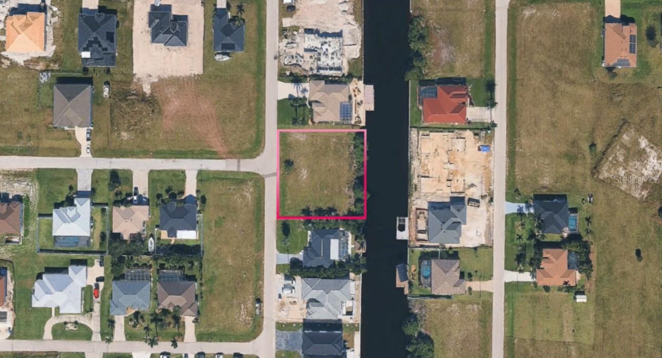 Canal Front Vacant Lot. Vacant residential lot located in the NW area of Cape Coral. Property backs to a canal, offering water views. Area features ongoing residential development with new construction nearby.
Convenient access to local roads, shopping, and dining. Buyer to perform all due diligence regarding utilities, zoning, flood zone, and building requirements.