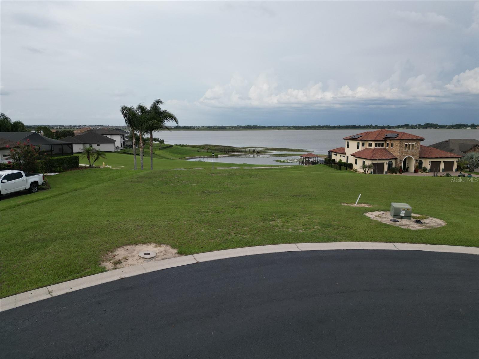 Build your dream home on this cleared homesite featuring panoramic views of beautiful Lake Alfred. Located in the wonderful gated community of Water Ridge, this cul-de-sac lot offers exceptional privacy with no rear neighbors.  Custom building plan may also be available.

Water Ridge residents enjoy an impressive selection of resort-style amenities, including three community pools, lighted tennis and pickleball courts, a clubhouse, a newly renovated fitness center, sauna, boat storage, two private boat ramps, a fishing pier, and much more!

Don't miss this opportunity to build your custom lake-view home in one of Central Florida's most desirable waterfront communities.