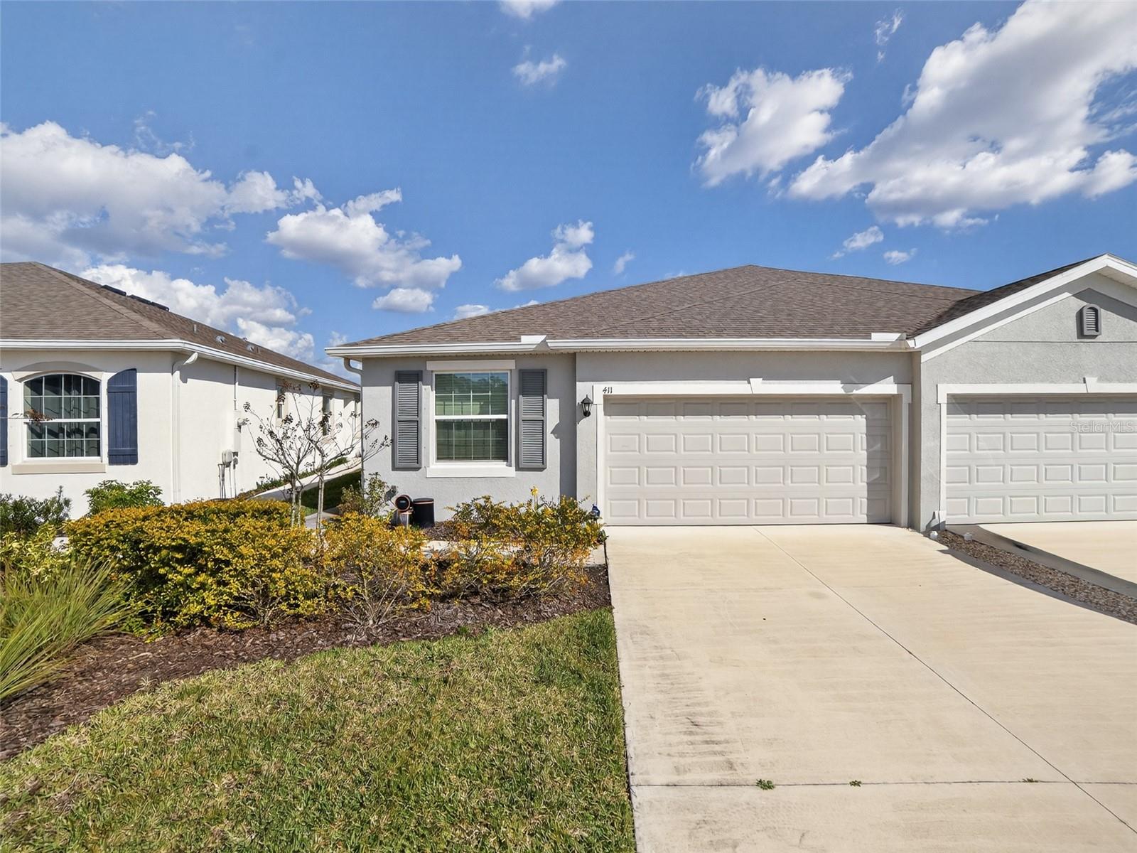 One or more photo(s) has been virtually staged. Florida living in this meticulously maintained 3BD/2BA villa featuring a pond view. The open-concept interior boasts gleaming tile flooring in the common area, creating a seamless and modern aesthetic. The kitchen is equipped with sleek stainless steel appliances, and a large island with Granite countertops. This home offers a spacious 2-car garage and a private screened lanai where you can enjoy water views. Ideally located near world-class beaches, shopping, and dining, this villa provides a low-maintenance lifestyle in a prime location. Move-in ready and waiting for you!