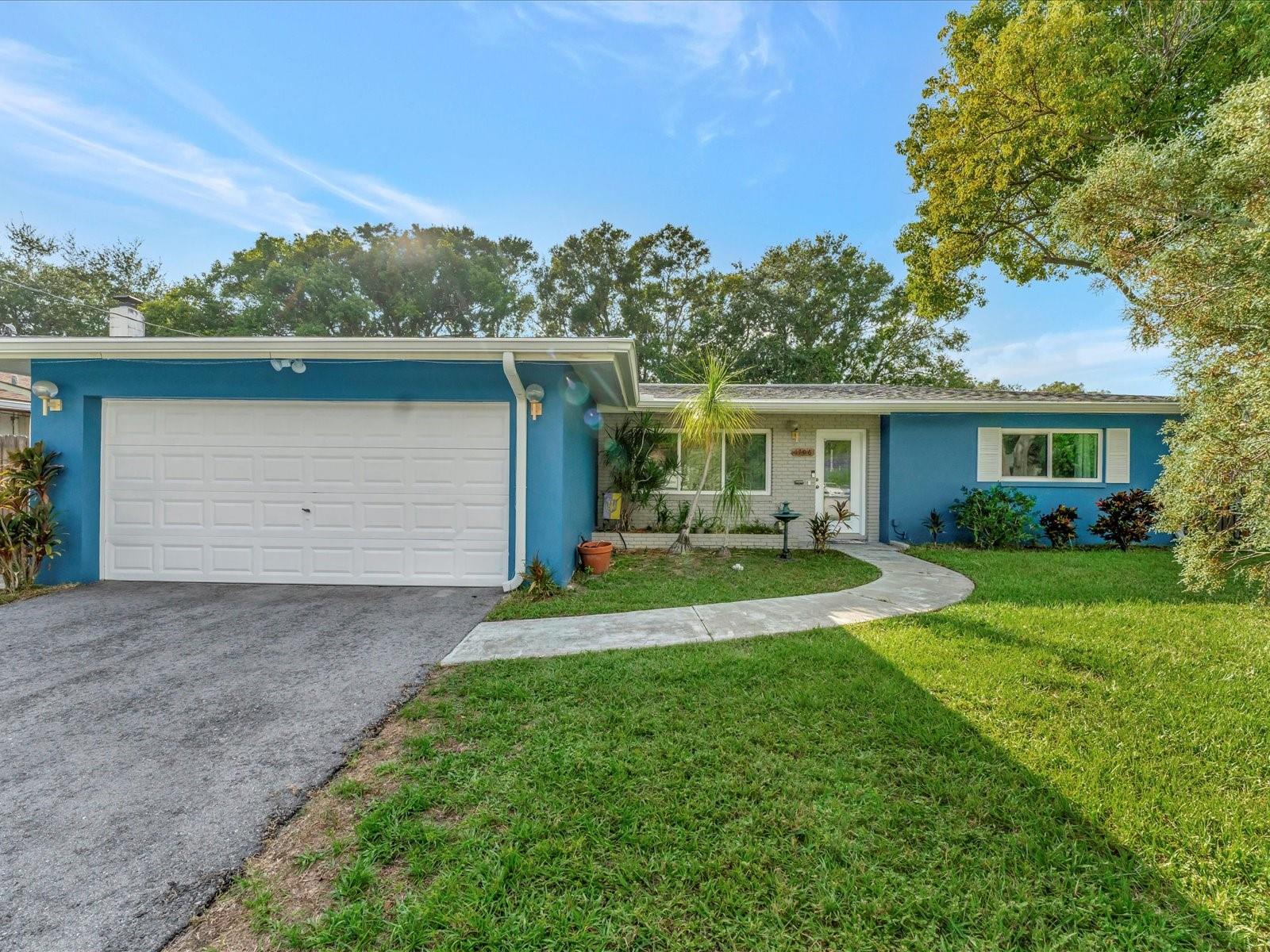 A prime Clearwater location and beautiful updating combine to make this property a must-see. Situated on a tranquil cul-de-sac in Chesterfield Heights, this 3BR 2BA pool home offers exceptional indoor and outdoor living.   The floor plan is open and features split bedrooms, engineered vinyl plank flooring that runs throughout, family room with stone fireplace, and upgraded kitchen with custom cabinets, granite countertops, and stainless-steel Whirlpool appliances. A hurricane rated sliding door opens to a huge fenced-in back yard that features a gorgeous pool, covered patio area, meditation garden, and banana, avocado, and mango trees. Impeccably maintained, the AC was replaced in 2018 and the roof replaced in 2017. The doors and windows were replaced in 2017 and 2020 and there is also an updated electrical system. New gutters with leaf guards were added in 2022 and there are also smart home features including a Nest thermostat and Ring doorbell. Close to great shops, restaurants, entertainment, and award-winning Clearwater Beach! No HOA and no flood insurance required! Call now to schedule your tour. Virtual tours are also available.