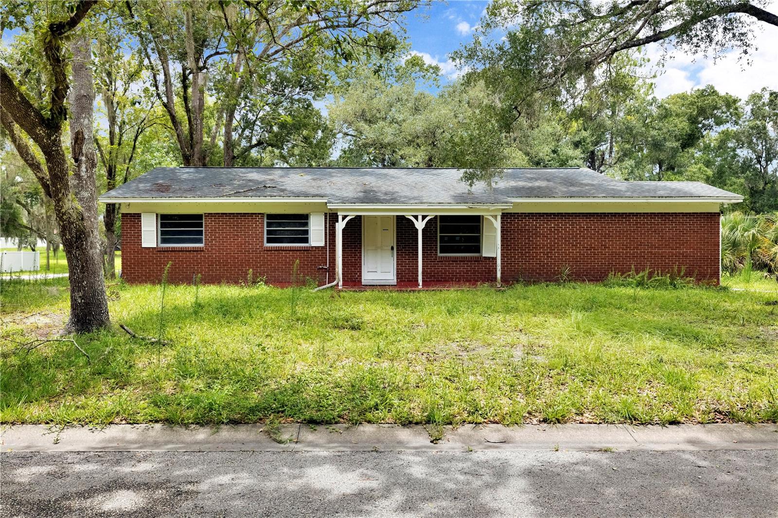 Investor special in Temple Terrace! This 2-bedroom, 2-bath single-family home presents a great opportunity for investors, contractors, or buyers looking to renovate and add value. Located on a spacious lot, with two additional parcels to total up to a 0.76 acre lot. This property offers plenty of potential to create a customized home or investment asset. Conveniently located near shopping, dining, schools, parks, and major roadways. Property is being sold as-is. Buyer to verify all measurements, condition, and property details.