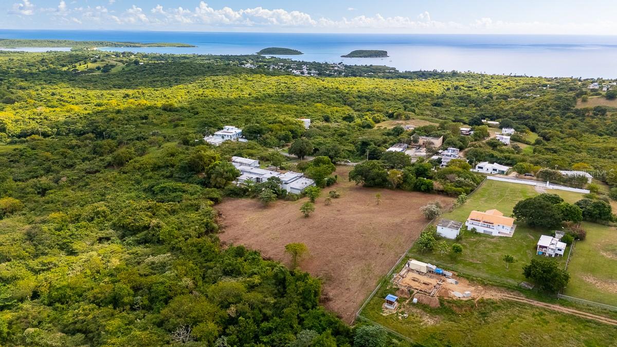 Offered at appraised value, this 13,420 square meter (3.31 acre) gently sloping and cleared lot in Puerto Real, Vieques, is ideal for building a private home or island retreat. Zoned Agricultural (AG), the property allows the construction of at least one primary residence in accordance with rural land-use guidelines.

The lot is fenced on three sides, with direct access to the main highway and utilities available nearby. A school sits next door, and primary homes are sparsely scattered throughout the peaceful neighborhood.

Set in a quiet, natural setting, the property is just a 5-minute drive to Esperanza, Sun Bay Beach, and the island’s south shore beaches, offering both privacy and convenience. This is a rare opportunity to own a sizable parcel in a tranquil location, offered at appraised value.