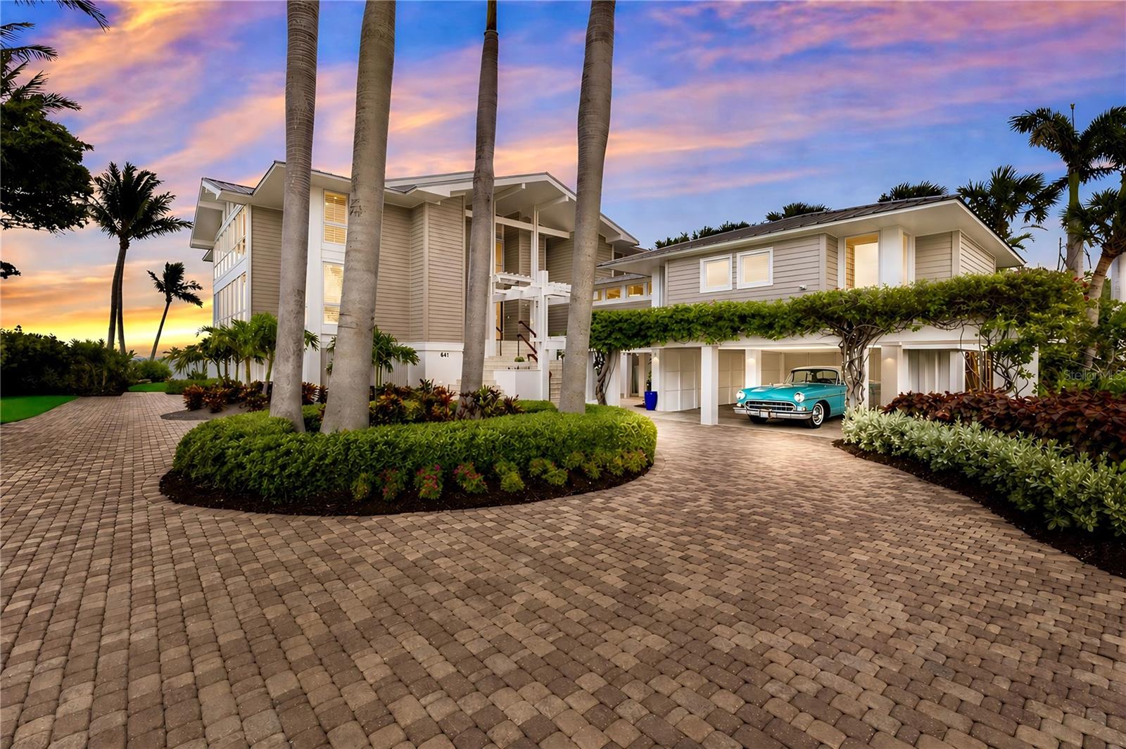 An extraordinary Grande Bay retreat where timeless Sarasota School of Architecture design meets breathtaking waterfront living. Privately positioned and designed to impress, this one-of-a-kind residence reveals itself through soaring volumes, clean lines, and walls of glass that frame mesmerizing waterfront views and invite you to stay. Light, space, and water converge to create an atmosphere that is both striking and serene. Designed for effortless living and inspired moments, the interiors flow seamlessly outdoors, creating a sense of calm, openness, and connection at every turn. A beautifully appointed kitchen and refined finishes throughout offer both comfort and understated sophistication. With deep water dockage and access to Boca Bay’s coveted amenities, this is more than a home, it is a place to experience.