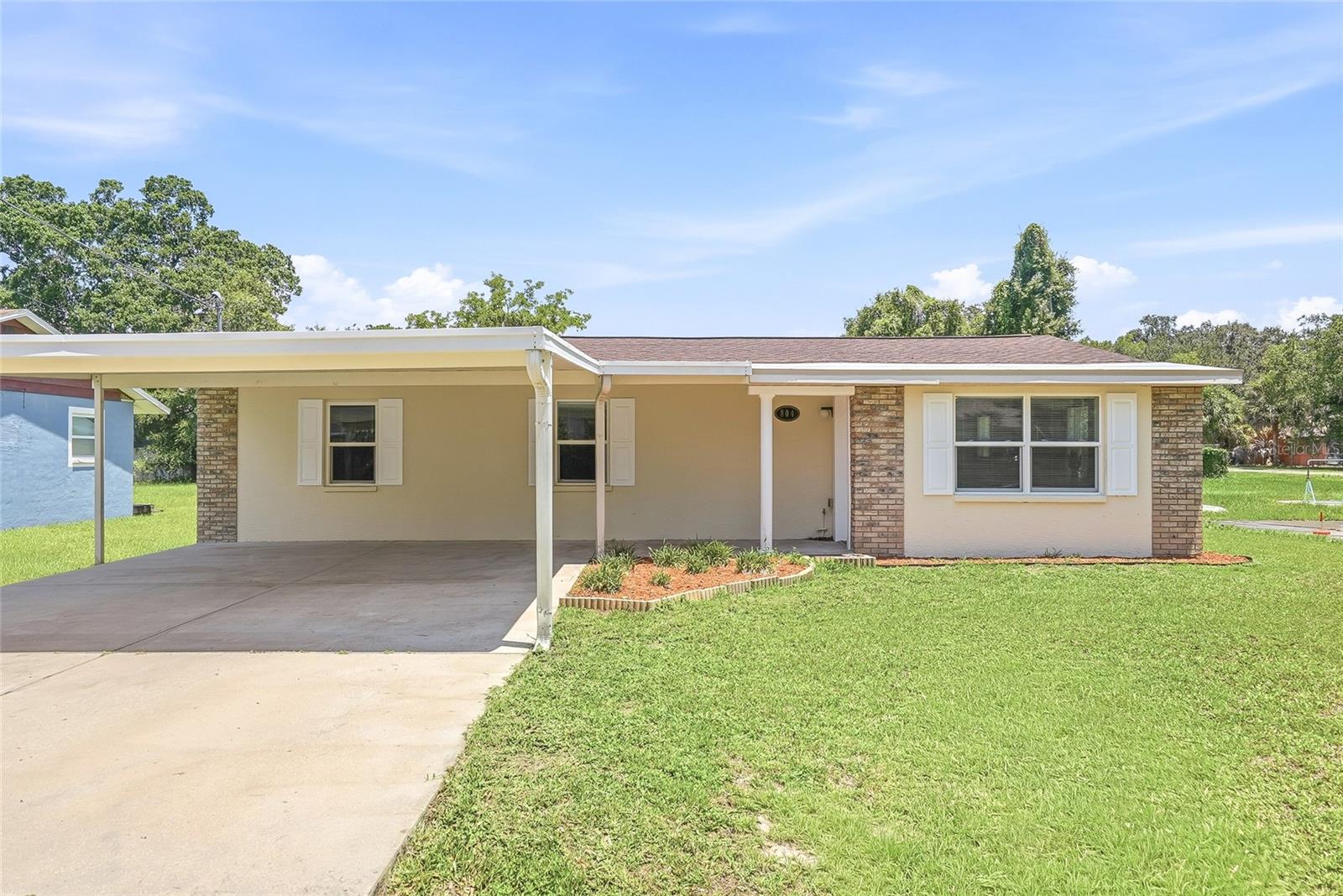 Welcome to this beautifully renovated 3-bedroom, 2-bathroom block home in the heart of Plant City, where modern updates, functional living spaces, and timeless design come together seamlessly. Step inside to a bright, open-concept layout featuring luxury vinyl plank flooring and abundant natural light throughout the main living areas. The fully updated kitchen serves as the centerpiece of the home, showcasing quartz countertops, soft-close cabinetry, and a full suite of brand-new stainless steel appliances, creating the perfect space for both everyday living and entertaining. The spacious primary suite features a walk-in closet and a beautifully renovated en suite bathroom, while the guest bathroom has also been thoughtfully updated with stylish finishes. Major improvements have already been completed, including a brand-new roof and a 2020 HVAC system, offering comfort and peace of mind for years to come. Outside, a two-car carport provides convenient covered parking, while the detached storage building offers endless possibilities as a workshop, hobby space, additional storage, or home project area. Ideally located just minutes from Historic Downtown Plant City, residents can enjoy local restaurants, shopping, parks, community events, and easy access to I-4 for commuting to Tampa, Lakeland, and beyond. Move-in ready and filled with quality upgrades, this home presents an exceptional opportunity to enjoy all that Plant City has to offer.