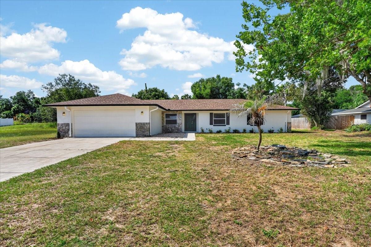 REMODELED POOL HOME + NO HOA + LARGE LOT!

Completely remodeled from top to bottom, this stunning 3-bedroom, 2-bath home sits on a spacious 0.37-acre lot and offers the perfect blend of modern updates, outdoor living, and everyday comfort.

Step inside to an open, airy floor plan with brand-new luxury vinyl flooring, fresh interior paint, updated lighting, ceiling fans, and stylish finishes throughout. The beautifully redesigned kitchen steals the show with sleek new cabinetry, a seamless, matching quartz countertop and backsplash, stainless steel appliances, and a lovely kitchen island with bar seating and extra storage—perfect for entertaining family and friends.

The split-bedroom layout provides privacy, while the spacious primary suite features a walk-in closet and a completely remodeled bathroom with a gorgeous retiled walk-in shower. The guest bathroom has also been fully renovated with all-new fixtures and finishes.

Outside, you'll find your own private Florida retreat. Enjoy the screened pool, oversized covered patio, and plenty of room to spread out in your spacious backyard. Need extra storage? The detached 288-square-foot building offers endless possibilities for a workshop, hobby space, or storage.

Even better, there is NO HOA and the property is NOT located in a flood zone. More Major improvements include a 2021 roof, new HVAC system and ductwork, new water heater, fresh exterior paint, and new landscaping. The property is also equipped with a 250-gallon propane tank connected to a generator, helping keep you prepared when unexpected power outages occur.

If you're looking for a fully updated, move-in-ready pool home with space, privacy, and peace of mind, this is the one you've been waiting for!