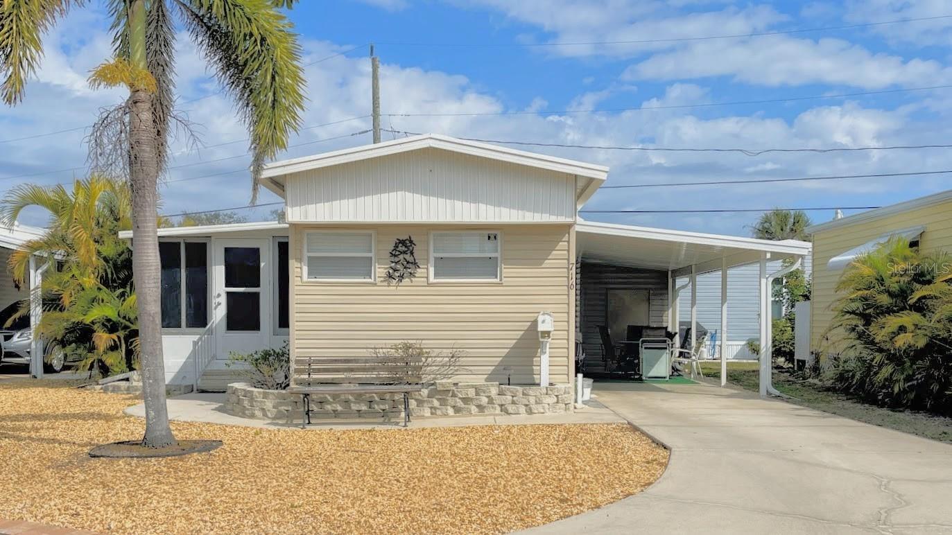 Bring your toothbrush! This home is move in ready, in this Resort Style Waterfront Community. This 2-bedroom, split plan is ready for you! Eat in kitchen with lots of cabinet space and beautiful countertops. Light and bright, lots of windows with shades. Wait until you see the screened enclosed lanai, with newer slide windows. Carport roof was put on in 2026. Lots of room for car or outside entertaining. Located in a vibrant 55+ community with full clubhouse amenities, this move-in-ready gem offers the active, carefree lifestyle you've been looking for. This beautiful community is located on Venice island. Enjoy the heated pool with water aerobics and exercise classes, Country Club Estates has two clubhouses. Both with kitchens. One clubhouse has a stage for bands and performances. The other overlooks the waterway with rented boat slips for the residents. From the boat club to the book club, you will probably find it here. Pickleball, shuffleboard, corn hole, billiards, ping pong, library, fitness center, most card games, karaoke, events planned for the holiday, local bands and DJ's for dances, neighborhood parades and scavenger hunts. Too many to list. This is not just a place to live--it is a lifestyle