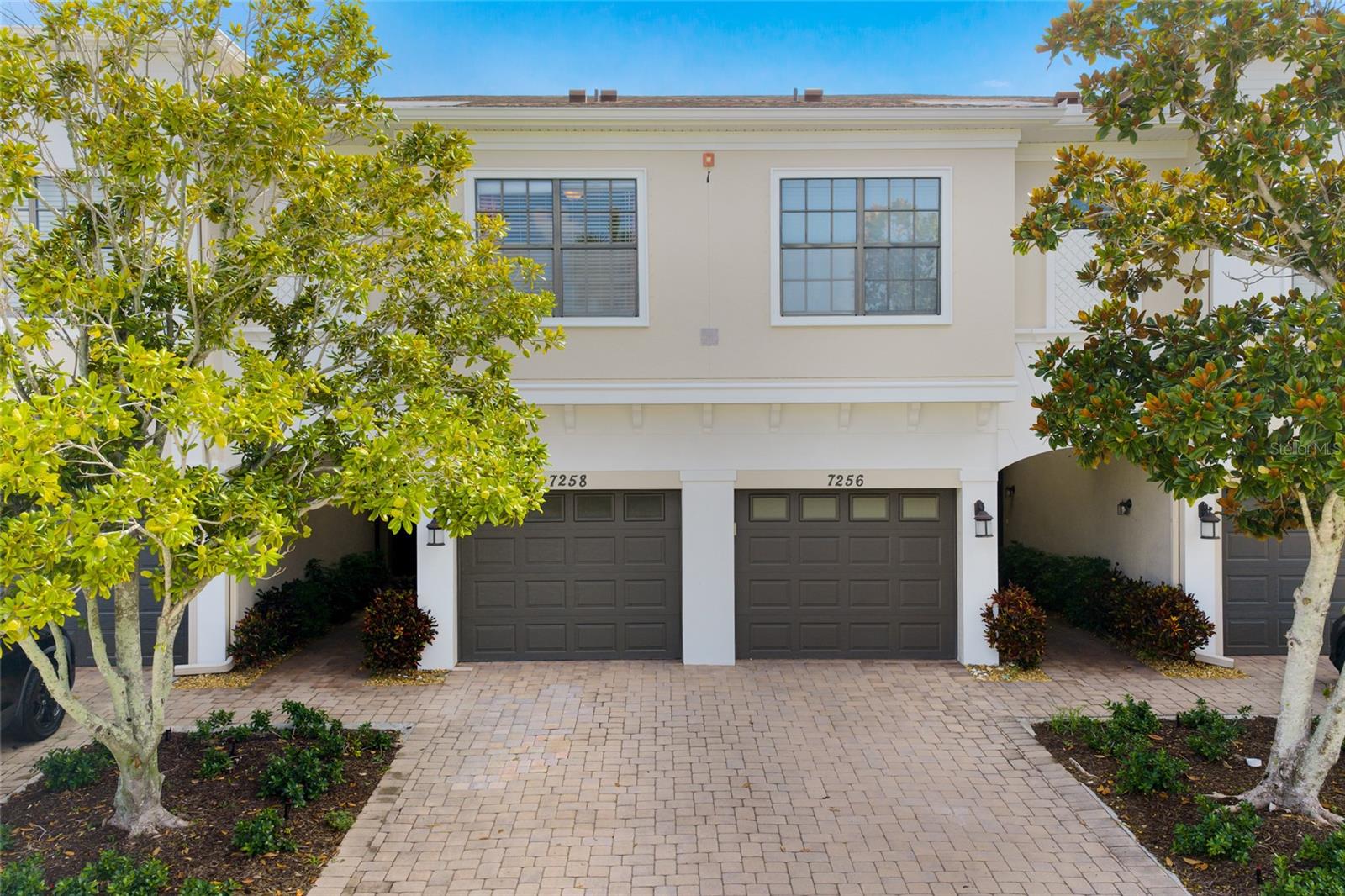 Welcome to Palma Sola Trace, one of the area's most desirable coastal communities where resort-style amenities, an unbeatable location, and the laid-back Gulf Coast lifestyle come together seamlessly. Just minutes from the sugar sand beaches of Anna Maria Island, you'll be perfectly positioned to enjoy waterfront restaurants, boating, fishing, beach days, and breathtaking sunsets whenever the mood strikes. Everyday conveniences are equally close with shopping, dining, coffee shops, and grocery stores all just around the corner. Outdoor enthusiasts will love being approximately two miles from the Palma Sola Causeway, a local favorite for kayaking, paddleboarding, jet skiing, horseback riding along the water, picnicking under the pavilions, and launching into some of the area's best coastal adventures. Robinson Preserve and Neal Preserve are also nearby, offering scenic walking trails, waterfront boardwalks, abundant wildlife, and beautiful natural surroundings. You'll also appreciate the convenient access to IMG Academy, several golf courses, Downtown Bradenton Riverwalk, and nearby Sarasota's renowned arts, dining, and entertainment scene.

This move-in ready 3 bedroom, 2.5 bathroom townhome offers over 1,500 sqft of living space with a 1-car garage and hurricane shutters for added peace of mind. Stepping inside, tile flooring flows throughout the first floor, complemented by granite countertops, ample cabinetry, and an open floorplan designed for comfortable everyday living and entertaining. A convenient half bathroom is located downstairs for guests.

Upstairs, all three bedrooms provide privacy away from the main living areas. The owner's suite features an oversized walk-in closet, newer carpet, and peaceful views overlooking the natural green space and creek. The guest bedrooms feature laminate flooring, while both full bathrooms are located upstairs for added convenience.

Sliding glass doors lead you out to the screened lanai where you can relax while enjoying tranquil views of the lush preserve, creek, and abundant birdlife. It's the perfect place to enjoy your morning coffee or unwind at the end of the day while taking in the peaceful surroundings.

Residents of Palma Sola Trace enjoy a low-maintenance lifestyle with beautifully maintained grounds and resort-style amenities including a heated lagoon-style swimming pool, clubhouse, fitness center, and playground. Whether you're searching for a full-time residence, seasonal getaway, or investment opportunity, this exceptional home offers the very best of Florida coastal living just minutes from Anna Maria Island.