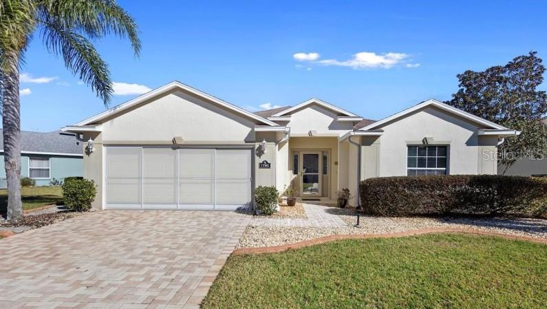 Lovely home in the exclusive 55+ community of Summerglen in Ocala. House has a beautiful curb appeal with brick pavers on the driveway, manicured landscape and no direct neighbors in the back. Once you enter you can observe an expansive living room that offers plenty of space for entertaining. Sliding glass doors open onto your back screened lanai with view of the golf course. The family room has neutral wood-looking tile and cathedral ceiling. The two guest bedrooms are on the front side of the house divided by a shared bathroom. The kitchen has newer matching appliances, granite countertops, breakfast bar and pantry. You also have a cozy breakfast nook surrounded by windows that have solar film to help block the heat and enjoy the view with full privacy. The owner’s suite is spacious enough with a big bed and furniture. The ensuite bathroom has a walk-in shower and a walking closet. The inside laundry has a new washer and dryer with cabinets for extra storage. The double car garage has a sliding screen and a pedestrian door. Summerglen is an absolute dream of a retirement community with easy access to I-75. The HOA fee covered on the monthly rent includes mowing and edging of grass, guard at gate, High speed internet and basic cable, trash pickup and other amenities. Summer Glen is an active lifestyle 55+ community offering entertainment and access to an 18-hole golf course, a restaurant, a clubhouse, an outdoor pool, a hobby and game room, sports courts, parking for your RV or boat and an array of other amenities. Long term rent only 1 year lease.