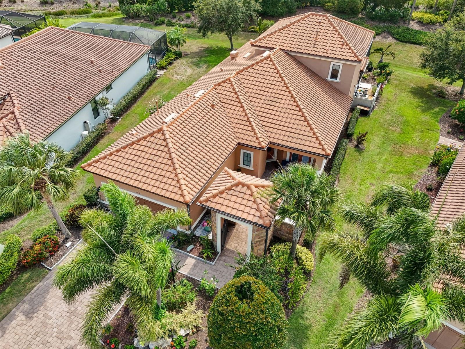 This is a great opportunity to make this unique and stunning Trevi Model in the premier Esplanade Golf and Country Club, Lakewood Ranch YOURS! Owners are ready to make a deal, offering partial seller financing if needed or desired. This meticulously maintained 3-bedroom, den, 3.5-bath gem is for sale with no mandatory golf membership. Boasting a chef’s kitchen with top-line cabinetry, stainless steel appliances, built-in oven, five-burner gas cooktop, upgraded flooring, and elegant crown molding, plantation shutters, dry bar, and courtyard with fountain. The office/den features a built-in desk, workstation, and feature wall. Enjoy main-level master and guest suites with en-suite baths, plus a second floor with a bonus media room (wet bar with refrigerator), private additional room, and full bath. Over $280k in upgrades, including a jaw-dropping $150k heated saltwater pool with mosaic inlay, floating invisible edge, spa, multi-level planters, yoga area, and outdoor kitchen. Nestled in a world-class golf community with a practice range and competitions, residents enjoy reduced golf rates. Unwind at the poolside Baja tiki bar, resort-style pool with lounge chairs and cabanas, or torch-lit fire pit evenings—perfect for family and friends. Savor the incredible weather with cooking classes, wine tastings, and first-class dining at the culinary center. Plus, access to a spa, fitness and wellness center, pickleball, and tennis courts! Just an hour from international airports, with world-renowned Siesta Key beaches, Saint Armand Circle, and downtown Sarasota’s European flair. Don’t miss the uniquely special weekly farmer’s markets in Lakewood Ranch and Sarasota. Features central vac, private backyard, updated pool heater and remote, brand new AC (2025)—luxury living awaits!