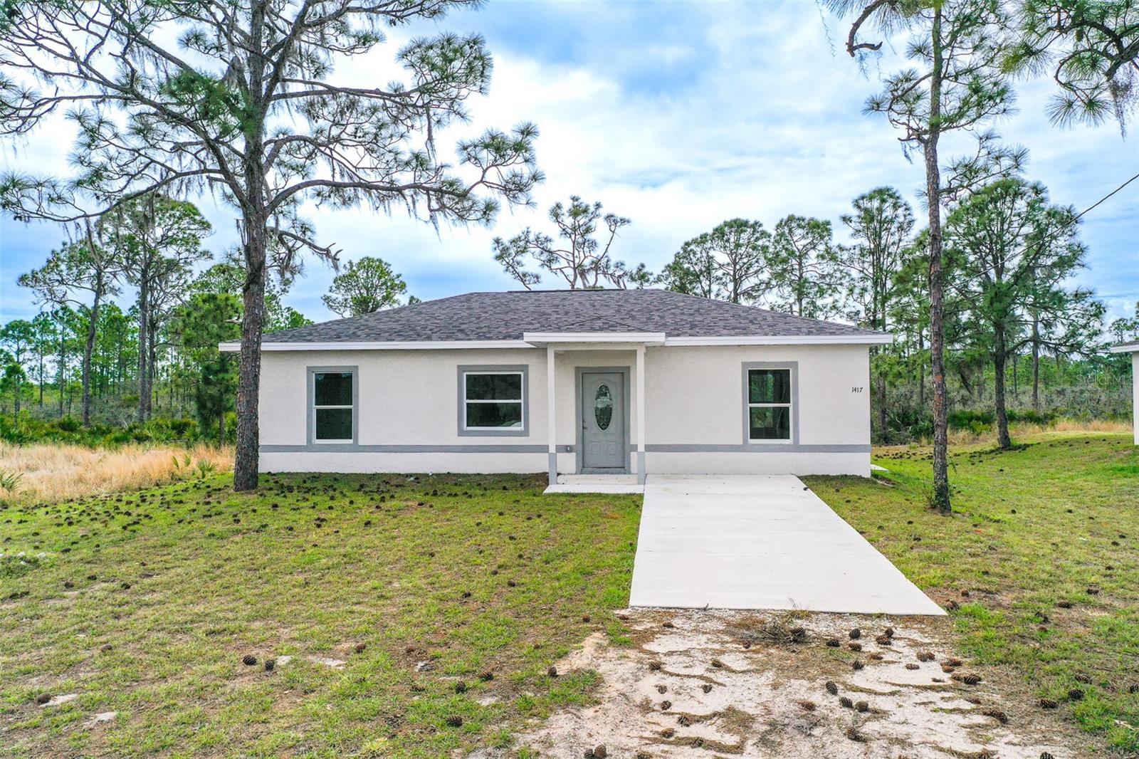 One or more photo(s) has been virtually staged. SELLER AGREES TO CONTRIBUTE UP TO $8,000 TOWARD BUYER’S CLOSING COSTS. New Construction! Welcome to this custom-built 2025 home offers 3 bedrooms, 2 bathrooms, and a bright open-concept design perfect for modern Florida living. The spacious living, dining, and kitchen areas flow seamlessly together and feature durable ceramic tile flooring throughout. The kitchen comes fully equipped with brand-new stainless steel appliances and plenty of cabinet space. The primary suite offers a private ensuite bathroom and a large walk-in closet. A separate laundry room adds everyday convenience. Step outside to the open back porch overlooking an approximately ¼-acre lot—perfect for relaxing or entertaining. Located in a USDA-eligible area with no HOA. The home also includes a one-year home warranty for added buyer peace of mind. Quiet neighborhood setting while still close to shopping, dining, and the many lakes Lake Placid is known for. Great opportunity for a primary home, seasonal retreat, or investment property.