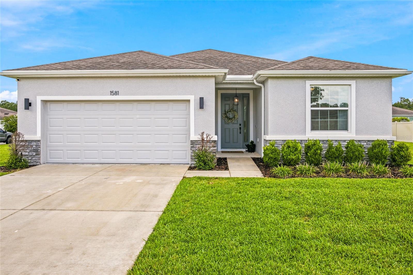 Virtually Staged. Welcome to the kind of home buyers hope to find, but rarely do.
Built in 2020 and beautifully maintained, this 4-bedroom, 2-bath home sits on one of the largest corner lots in the community (.38 acres). The open split floor plan is filled with natural light and features luxury vinyl plank flooring in the bedrooms (no carpet), granite countertops, a large kitchen island, stainless steel appliances, updated light fixtures, custom blinds, built-in closet organizers, and a spacious walk-in pantry.
Enjoy the oversized screened lanai overlooking the expansive backyard, perfect for relaxing, entertaining, or creating your own outdoor oasis. High-end washer and dryer, gutters, and an epoxy-coated garage floor are all included.
Conveniently located on Ocala's growing SE side, just minutes from shopping, dining, medical facilities, and major highways. This home is truly move-in ready, just bring your furniture.