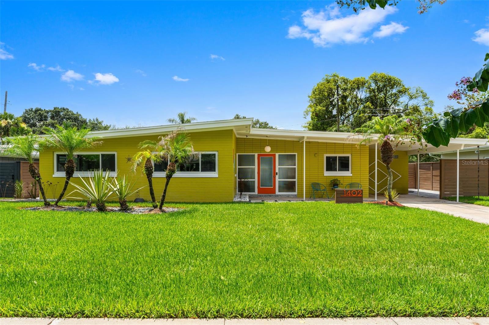 Experience the timeless appeal of this exceptional mid-century modern POOL HOME! in the heart of College Park, where the owners have taken great pride in preserving the home's iconic architectural character while thoughtfully blending it with modern comforts. Defined by its clean horizontal lines, distinctive Roman brick exterior, expansive sliding glass doors, and deep roof overhangs, this home embodies the timeless design principles that have made mid-century modern architecture so endearing. Every detail has been carefully considered to honor the home's original character while enhancing everyday living.
Inside, porcelain tile flooring with the classic look of TERRAZO flows throughout the main living areas, while original parquet flooring in all three bedrooms preserves the warmth and authenticity that mid-century enthusiasts appreciate. The functional layout embraces natural light and creates a seamless connection between indoor and outdoor living.
The expanded primary suite serves as a private retreat, offering generous space, a spacious walk-in closet, and the comfort and functionality today's buyers desire while remaining true to the home's architectural integrity.
An enclosed porch extends the living space and features expansive SLIDING GLASS DOORS that fully open to the backyard, blurring the line between indoors and out—one of the defining characteristics of mid-century modern design.
Step outside to your own private backyard oasis featuring a sparkling SALTWATER POOL, an outdoor shower, lush tropical landscaping, two sheds for additional storage and inviting outdoor living spaces designed for relaxing, entertaining, and embracing the Florida lifestyle. The covered patio is equipped with an outdoor misting system, providing a refreshing way to stay cool while dining al fresco, hosting guests, or simply unwinding poolside on warm Florida days. This home was also featured in the movie " A CHRISTMAS KAREN"


Enjoy the walkable lifestyle that makes College Park one of Orlando's most desirable neighborhoods. Just moments from the boutiques, restaurants, cafés, and entertainment along the vibrant Edgewater Drive corridor—including The Great Southern Box Company—you'll love having local favorites just minutes from your doorstep. With convenient access to I-4, Downtown Orlando, Winter Park, Advent Health, and Orlando Health, this exceptional residence offers the perfect combination of timeless architecture, thoughtful updates, and an unbeatable location.