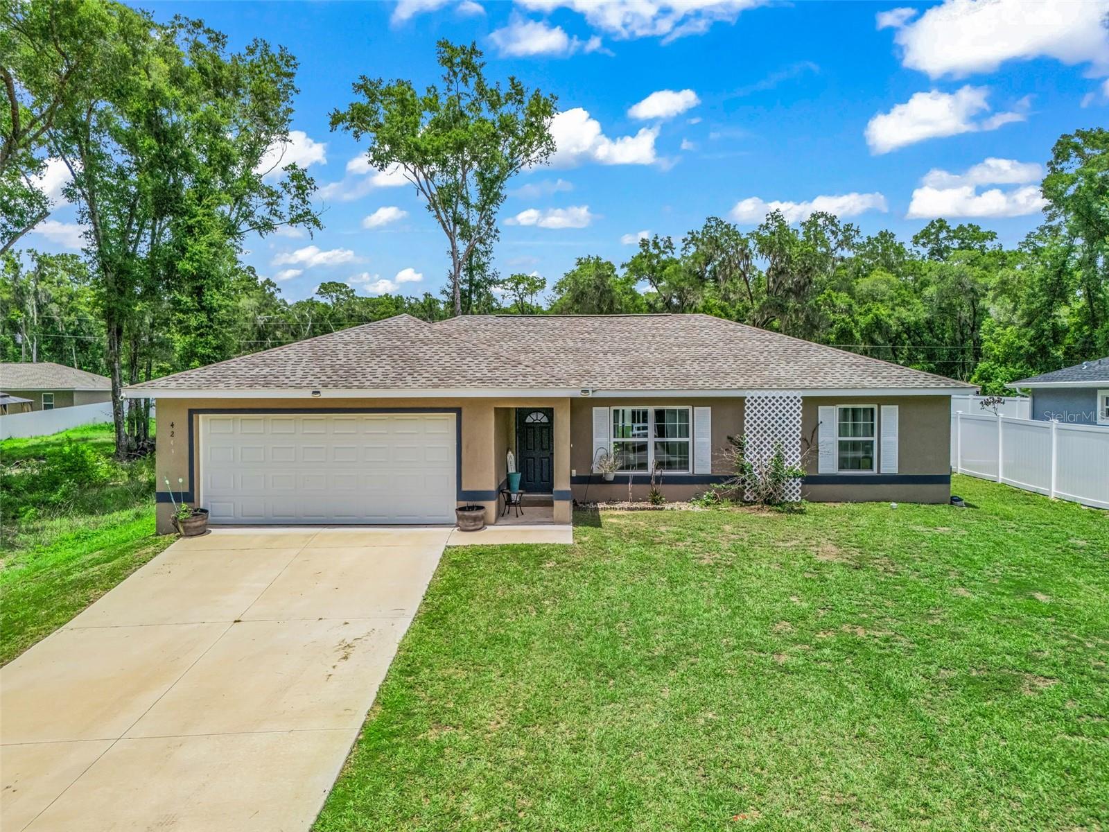 Welcome to your modern country retreat in Belleview Heights! Built in 2024 and beautifully enhanced with brand-new Luxury Vinyl Plank (LVP) flooring, this pristine 3-bedroom, 2-bathroom home features a highly desirable split floor plan for maximum privacy.At the heart of the home is a thoughtfully designed kitchen complete with high-end, soft-close cabinetry and elegant granite countertops. The kitchen sink is perfectly positioned beneath a bright window, offering peaceful views of your spacious backyard.Situated in the quiet community of Belleview Heights, this property delivers a serene, rural atmosphere without sacrificing modern convenience. Enjoy a quiet neighborhood retreat while maintaining quick proximity to the City of Belleview, Ocala, and The Villages. This prime location offers access to top-rated schools, close proximity to major highways, and a short commute to two major employment hubs. Don't miss this perfect blend of country charm and urban accessibility—schedule your tour today!